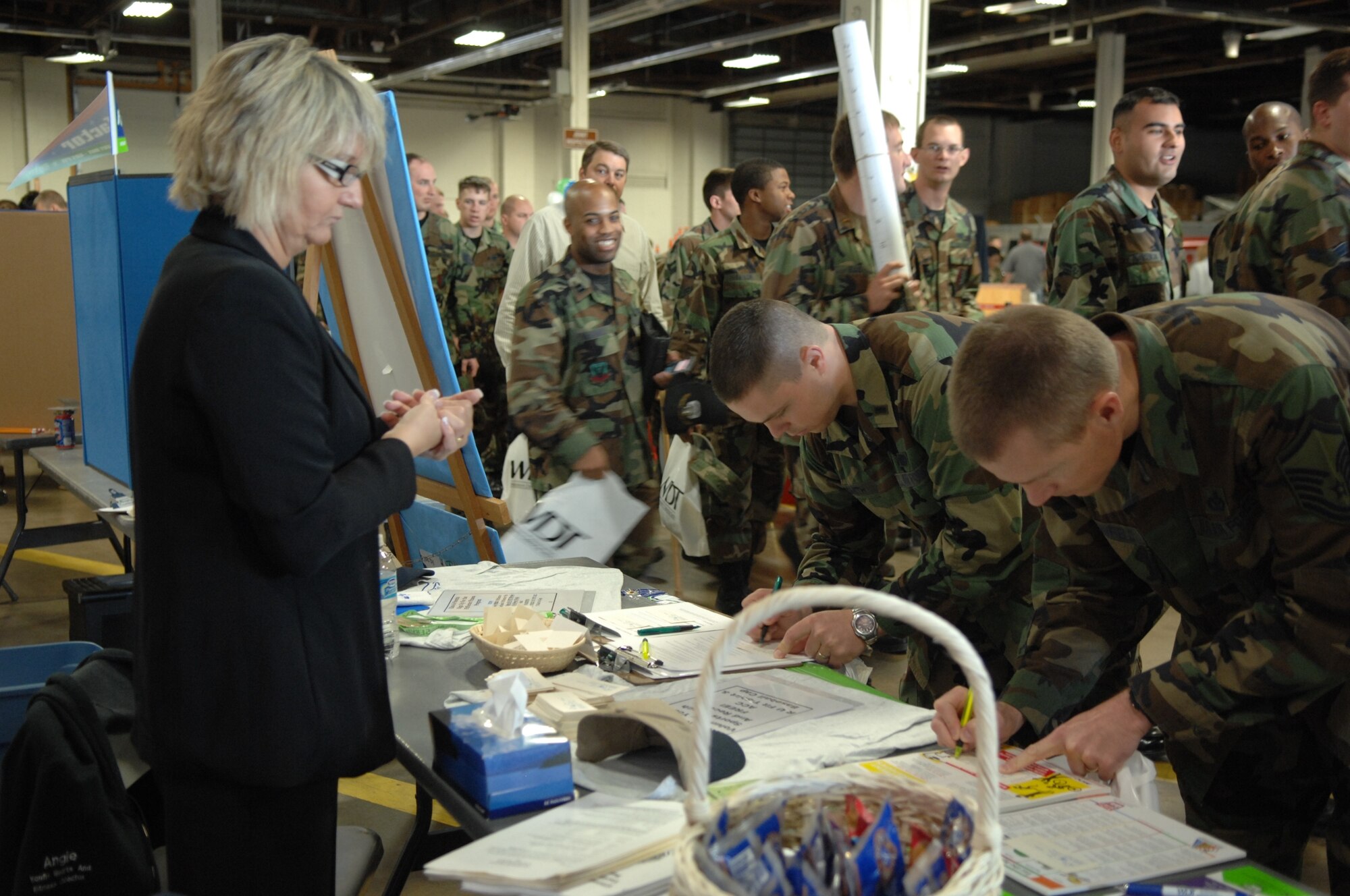 Ellsworth Airmen check out the different information stands during Discover the Hills here May 28, 2007. The event provides Airmen and their families a chance to become more familiar with activities at the base and in the surrounding communities; Discover the Hills 2008 is scheduled for May 22 from 9:30 a.m. to 5 p.m. (U.S. Air Force photo/A1C Anthony Sanchelli)
