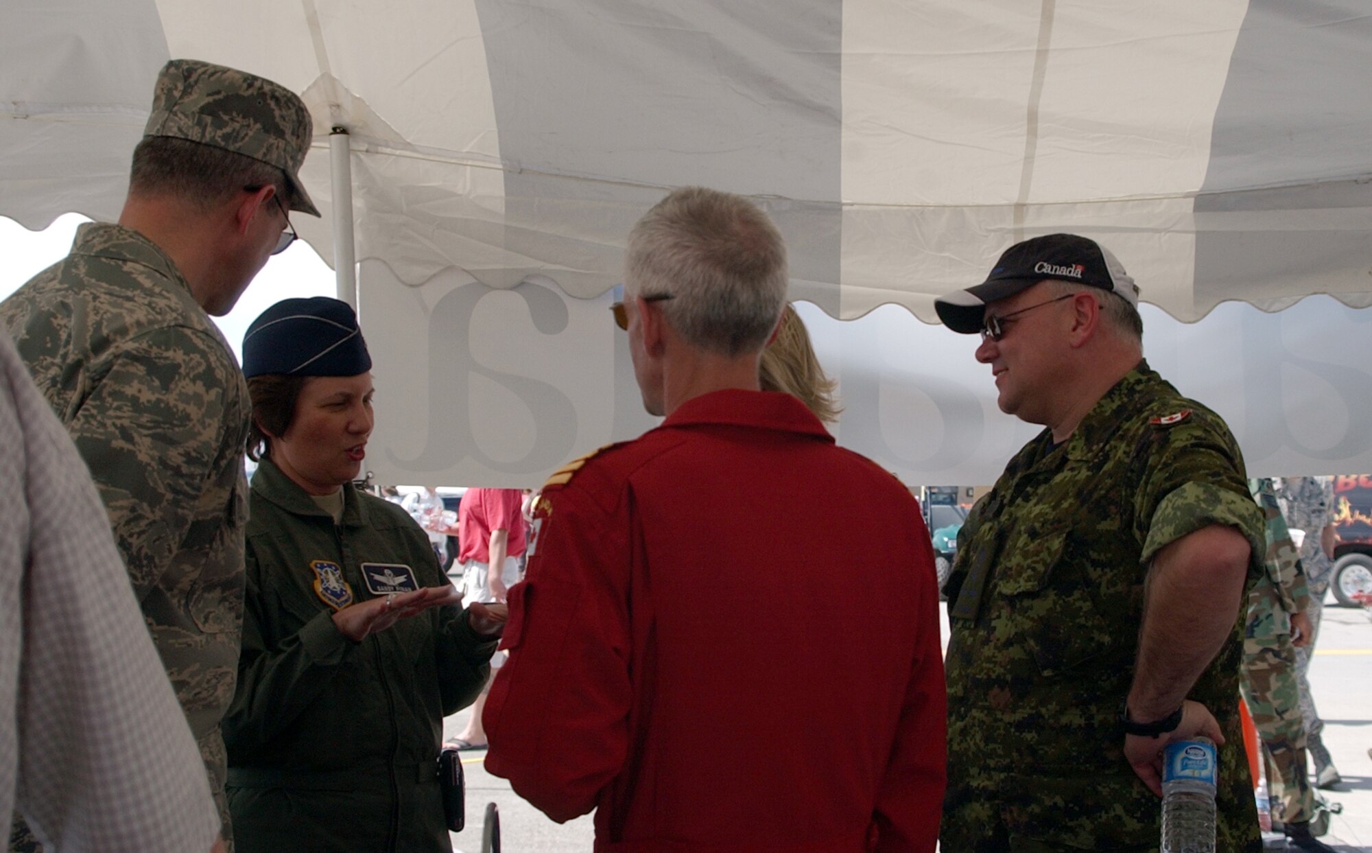 (Left to right) Col. Paul Gydesen, 341st Space Wing deputy commander; Col. Sandy Finan, 341st SW commander; Suzanne Gydesen; Lt. Gen. Charles Bouchard, North American Aerospace Defense Command deputy commander; and Col. Richard Foster, 15 Wing, Moose Jaw, Saskatchewan commander, get acquainted at a meet and greet May 17. The Canadian Air Force's Snowbirds aerial demonstration team performed shortly afterwards. (U.S. Air Force photo/Valerie Mullett)
