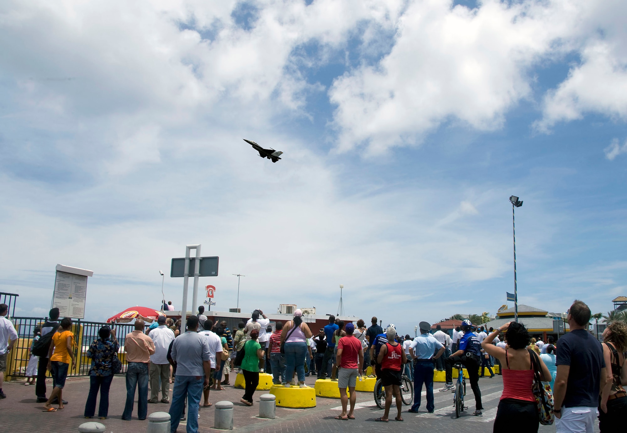 An F-16 Fighting Falcon, flown by Capt. George Clifford of the Viper East F-16 demonstration team, flies over Curacao, Netherlands Antilles.  The Viper East team, from Shaw Air Force Base, S.C., joined officials from Air Forces Southern headquarters at Davis-Monthan AFB, Ariz., to augment "Dutch Navy Days," a celebration put on every three years by the Dutch military to honor their naval heritage and partnership with the people of Curacao. (Courtesy photo/Peter Bijpost)