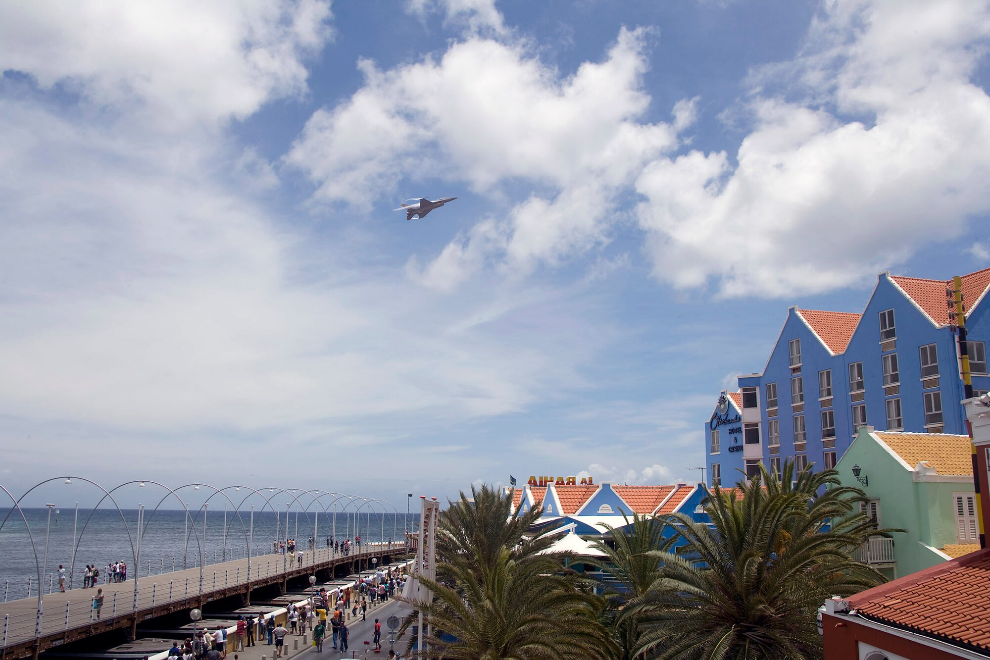An F-16 Fighting Falcon, flown by Capt. George Clifford of the Viper East F-16 demonstration team, flies over Curacao, Netherlands Antilles.  The Viper East team, from Shaw Air Force Base, S.C., joined officials from Air Forces Southern headquarters at Davis-Monthan AFB, Ariz., to augment "Dutch Navy Days," a celebration put on every three years by the Dutch military to honor their naval heritage and partnership with the people of Curacao. (Courtesy photo/Peter Bijpost)