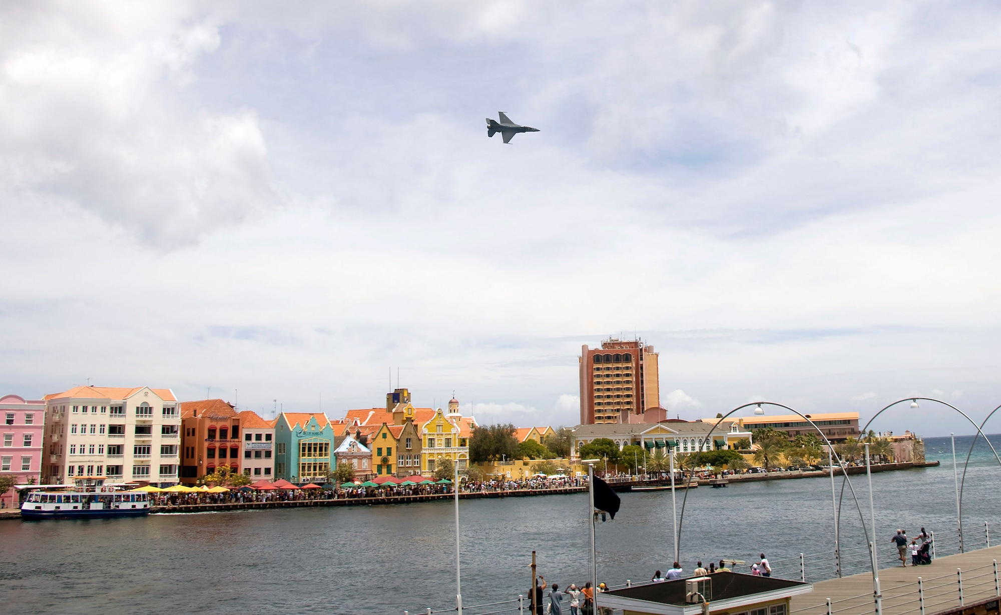 An F-16 Fighting Falcon, flown by Capt. George Clifford of the Viper East F-16 demonstration team, flies over Curacao, Netherlands Antilles.  The Viper East team, from Shaw Air Force Base, S.C., joined officials from Air Forces Southern headquarters at Davis-Monthan AFB, Ariz., to augment "Dutch Navy Days," a celebration put on every three years by the Dutch military to honor their naval heritage and partnership with the people of Curacao. (Courtesy photo/Peter Bijpost)