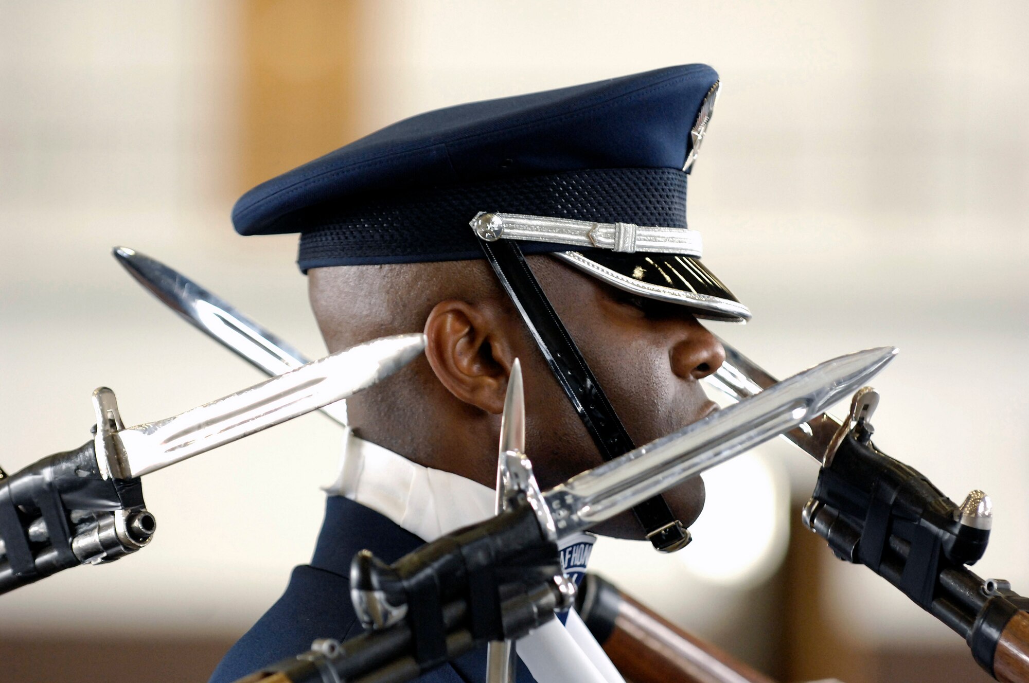 Master Sgt. Steven West remains poised as Air Force Honor Guard Drill Team weapons fly by during a performance May 13 at Ellsworth Air Force Base, S.D. The team is the traveling component of the Air Force Honor Guard and tours world-wide representing all Airmen and showcasing Air Force precision to recruit, retain and inspire for the Air Force mission. Sergeant West is the drill team superintendent. (U.S. Air Force photo/Senior Airman Dan DeCook) 