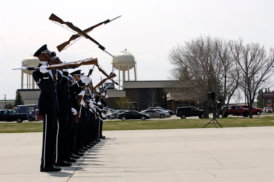 Rifles cross perfectly during the Air Force Honor Guard Drill Team's line sequence May 8 at Minot Air Force Base, N.D.  The team is the traveling component of the Air Force Honor Guard and tours world-wide representing all Airmen and showcasing Air Force precision to recruit, retain and inspire for the Air Force mission. (U.S. Air Force photo/Senior Airman Dan DeCook) 
