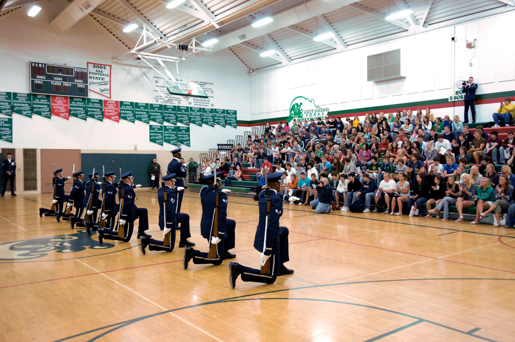 Students at East Grand Forks High School hold a special assembly May 7 to watch the Air Force Honor Guard Drill Team perform at Grand Forks, N.D. The drill team is the traveling component of the Air Force Honor Guard and tours world-wide representing all Airmen and showcasing Air Force precision to recruit, retain and inspire for the Air Force mission. (U.S. Air Force photo/Senior Airman Dan DeCook) 
