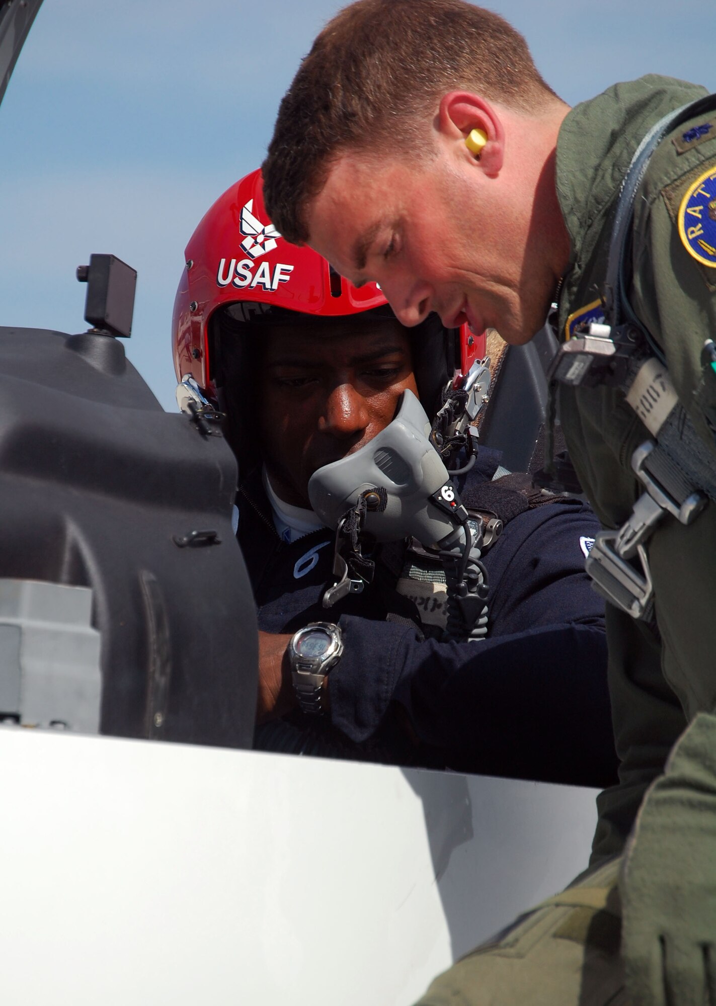 LAUGHLIN AIR FORCE BASE, Texas – Lt. Col. Paul Beineke, 47th Operations Support Group commander, gives specific instructions to Maj. Dyon Douglas, Thunderbird pilot, before flying in a T-6 Texan II here May 8. (U.S. Air Force photo by Airman 1st Class Sara Csurilla) 