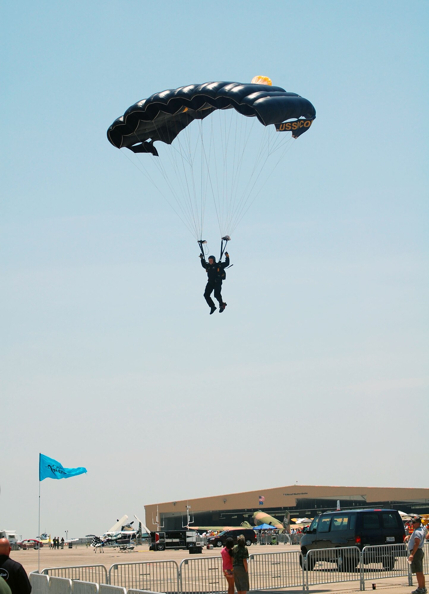 LAUGHLIN AIR FORCE BASE, Texas – A member of the SOCOM parachute team prepares himself for landing on the flight line here during their demonstration at Thunder Over the Amistad air show May 10. (U.S. Air Force photo by Airman 1st Class Sara Csurilla) 