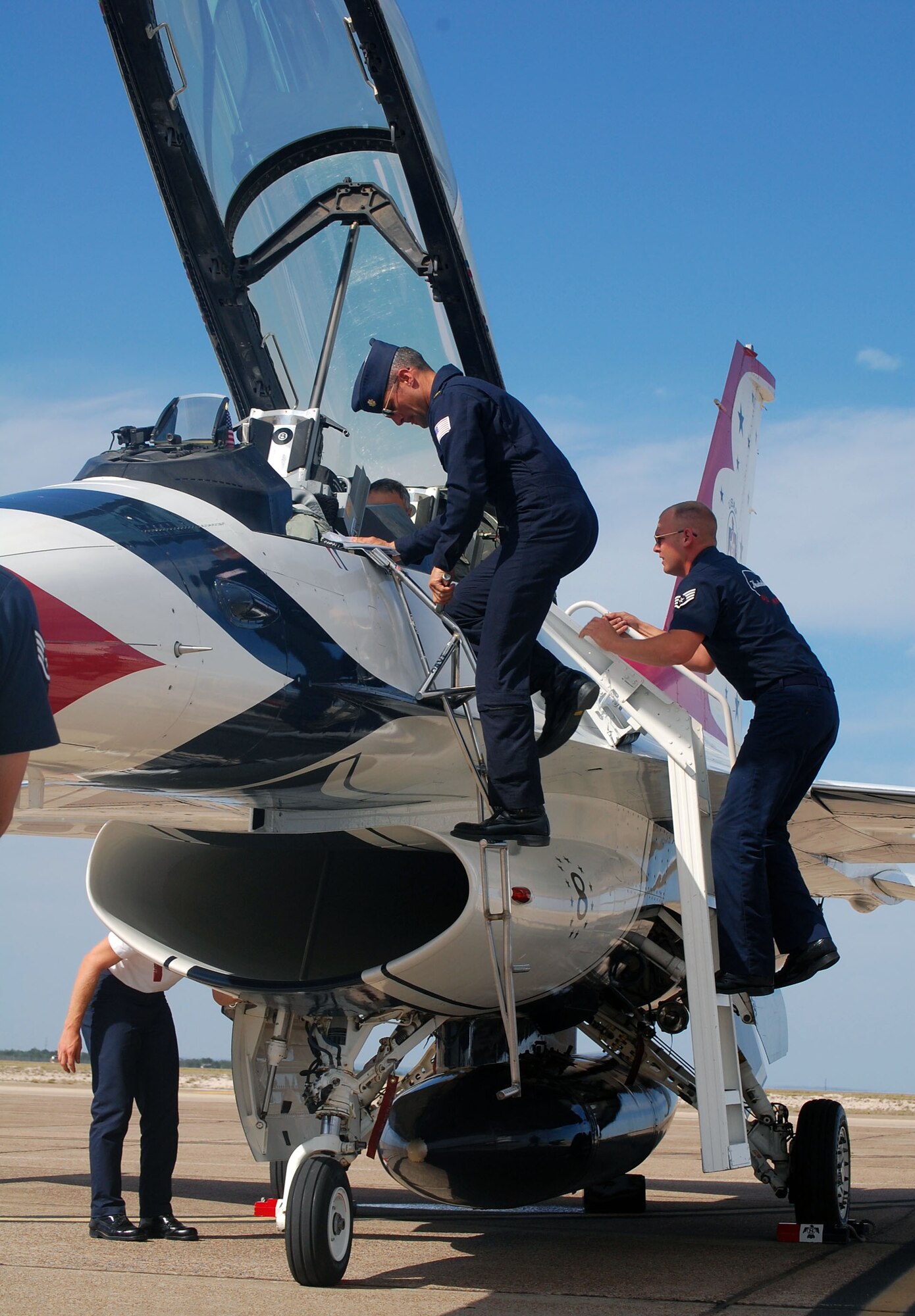LAUGHLIN AIR FORCE BASE, Texas – Maj. Anthony Mulhare, Thunderbird advance pilot, retreats from his F-16 Fighting Falcon after flying Nick Khoury, Del Rio Live, on a media orientation flight here May 8. (U.S. Air Force photo by Airman 1st Class Sara Csurilla) 