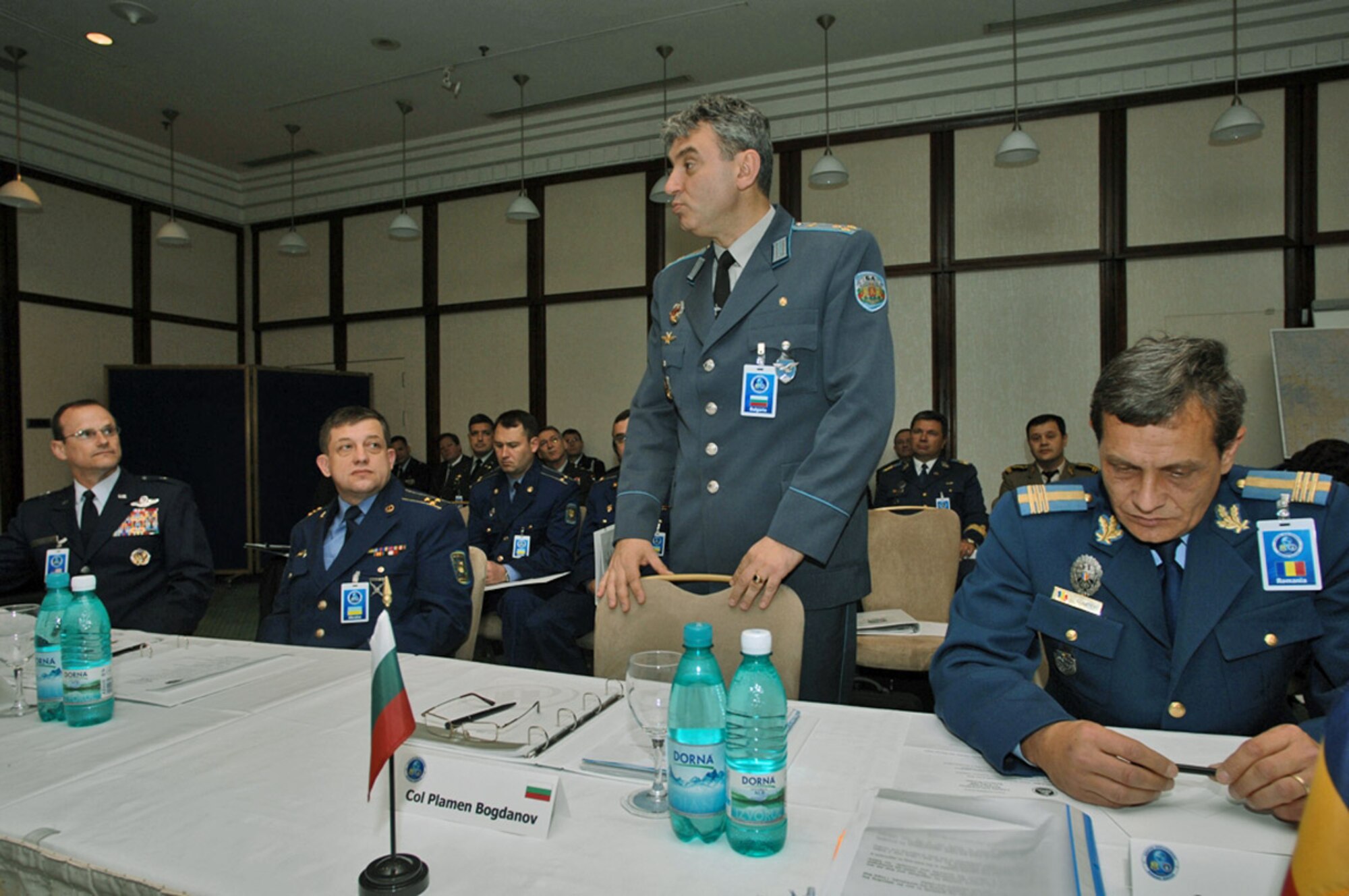 Bulgarian Col. Plamen Nikolov Bogdanov briefs Air Force Brig. Gen. Richard Johnston (far left) and other participants in the Romania Building Partnership Seminar. The seminar was part of Unified Engagement, a transformation wargame designed to explore future joint warfighting concepts and capabilities. The event in Romania consisted of approximately 60 military leaders and support staff members from eight nations focused on objectives that maximize cooperation and coalition building.  (U.S. Air Force photo/Master Sgt. Chris Stone)
