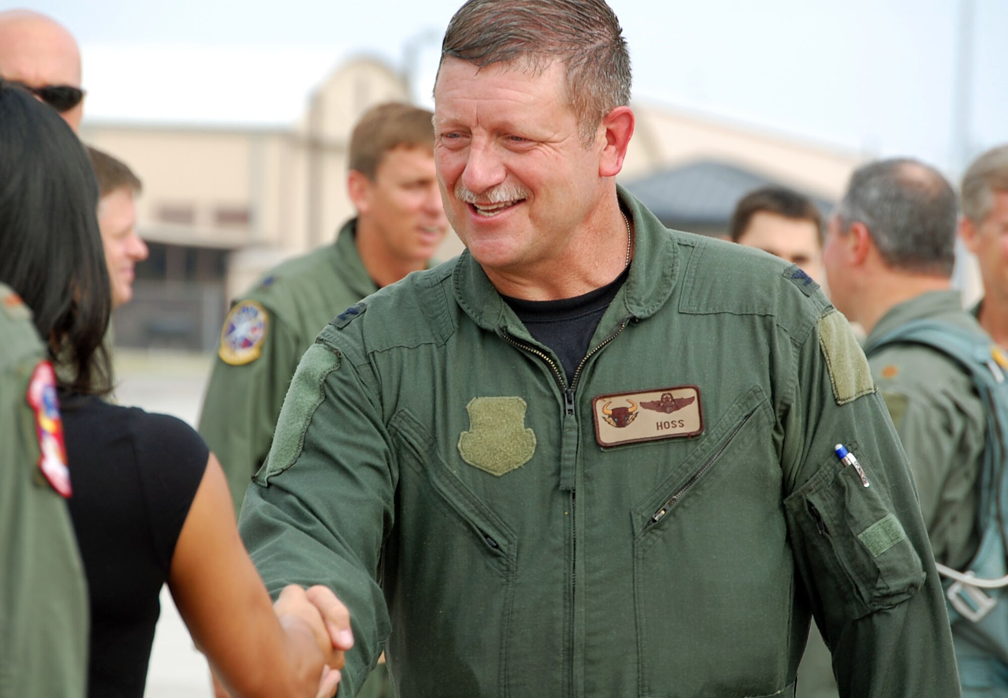 LAUGHLIN AIR FORCE BASE, Texas – Col. Dan Laro Clark, 47th Flying Training Wing vice commander, says goodbye to a line of members of Team XL after a congratulatory soak down from his daughter Alley and others after his final flight at Laughlin in a T-38 Talon II May 13. Colonel Clark was selected to fill the vice commander position at the 19th Air Force at Randolph Air Force Base, Texas. Colonel Clark served more than two years as the vice commander here. (U.S. Air Force photo by Airman 1st Class Sara Csurilla)