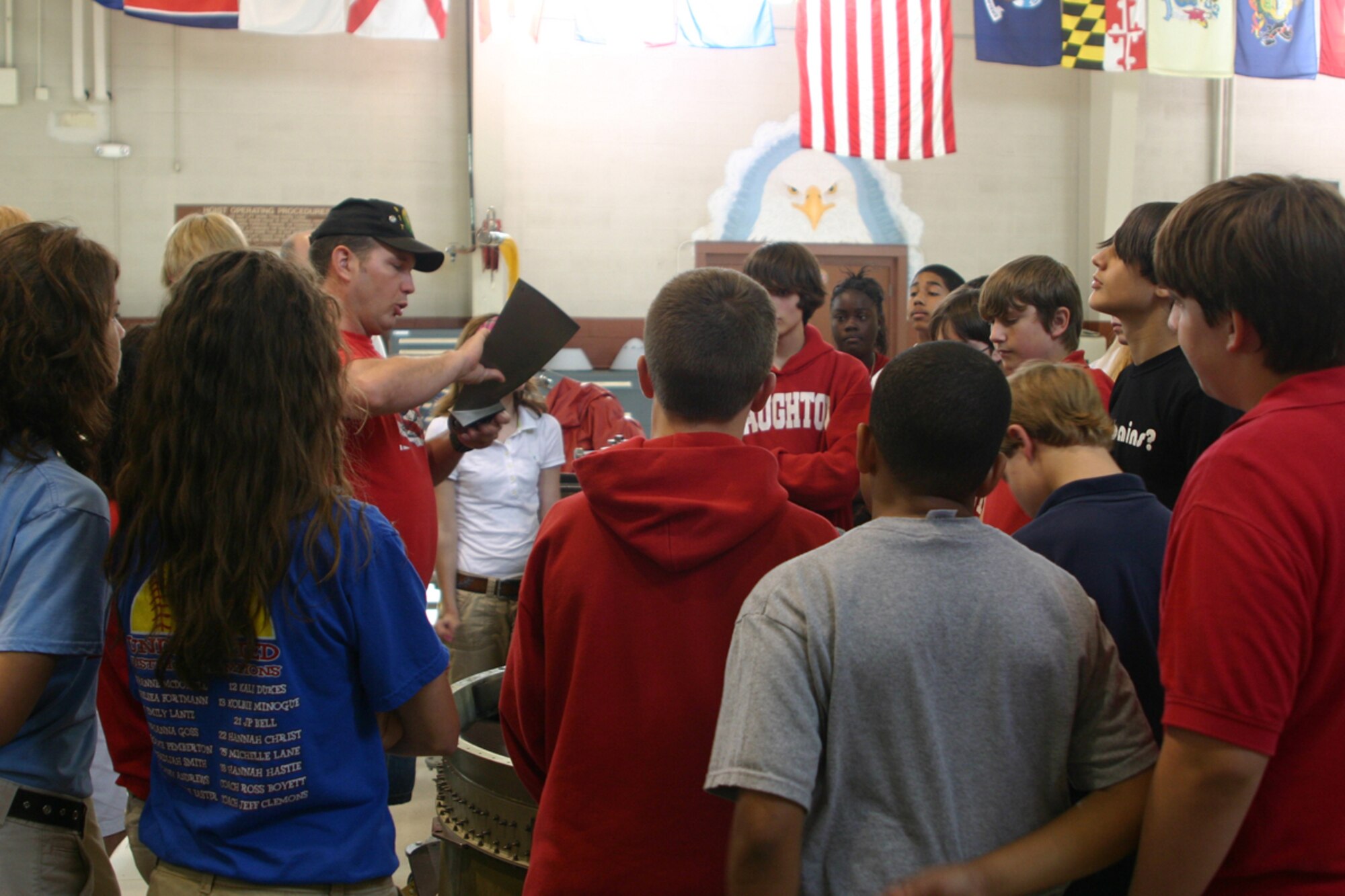 Kerry Rains, 47th Fighter Squadron, air reserve technician, instructs students from Haughton Middle School's Aero Science Space Class about fan blades on a jet engine during a tour of the 917th Wing, Friday, May 16, 2008. The students also visited the engine and armament shops, Red River Dinning facility, a B-52 Stratofortress and wrapped up their tour at the 8th Air Force Museum. (U.S. Air Force photo/Tech. Sgt. Jeff Walston)