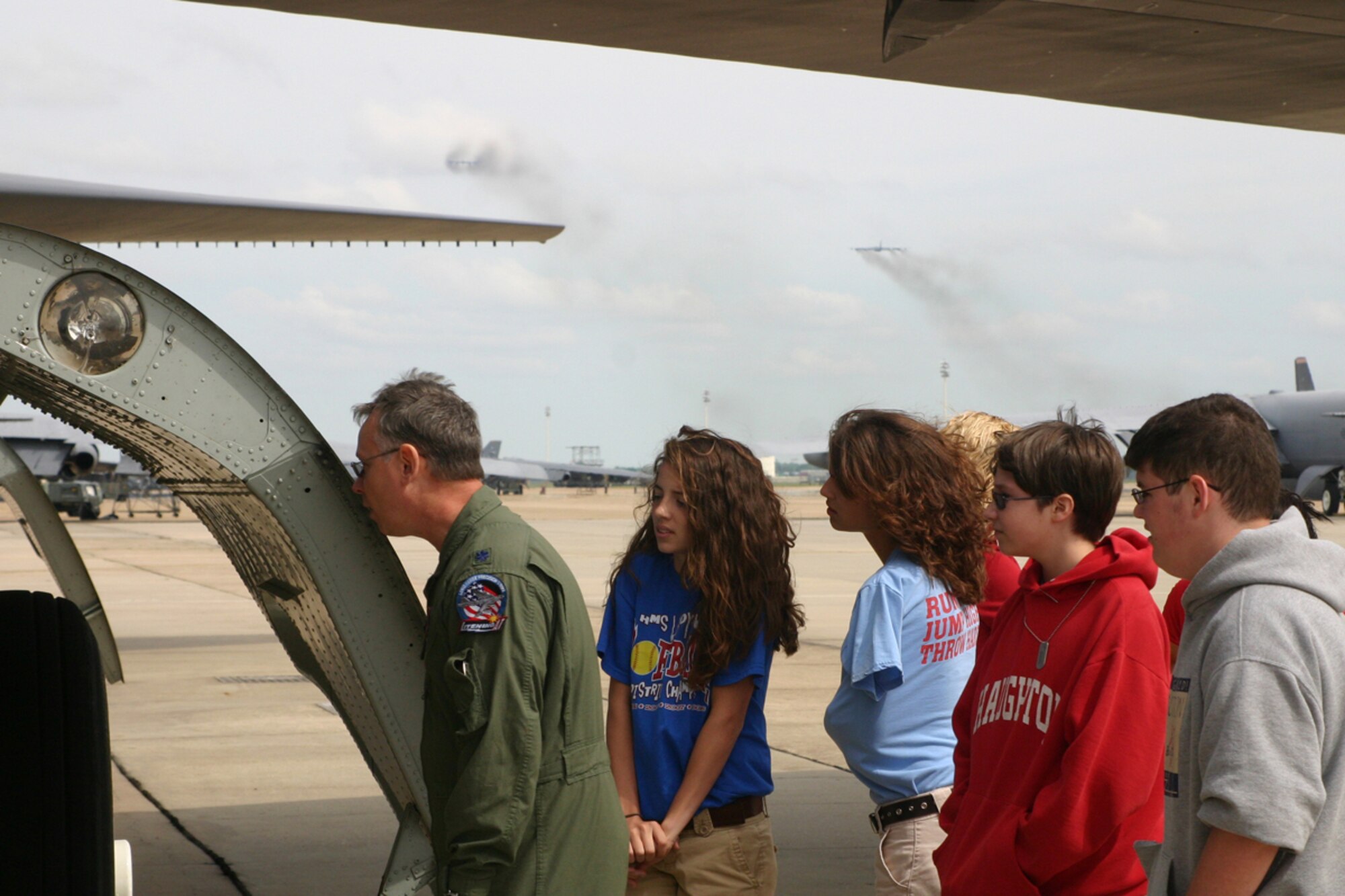 Lt. Col. Joseph C. Jones, 47th Fighter Squadron, director of operations, prepares to enter the bomb bay of a B-52 Stratofortress with students from Haughton Middle School's Aero Science Space Class as two B-52s take off during a tour of the 917th Wing, Friday, May 16, 2008. The students also visited the engine and armament shops, Red River Dinning facility, an A-10 Thunderbolt and wrapped up their tour at the 8th Air Force Museum. (U.S. Air Force photo/Tech. Sgt. Jeff Walston)