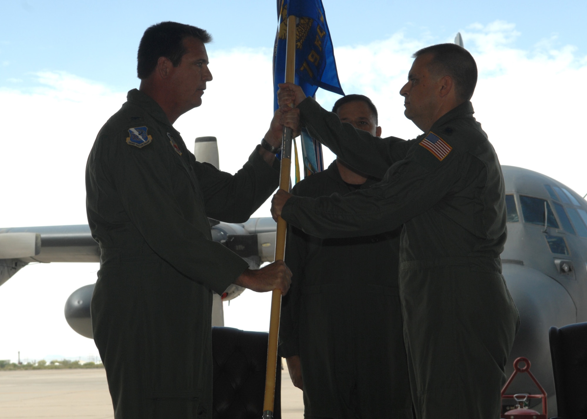 Lt. Col. Joe Pace (right) receives the 79th Rescue Squadron guidon from the 563rd Rescue Group Commander Col. Lee dePalo, during a change-of-command ceremony here May 9.  Colonel Pace is a command pilot with over 2,800 flying hours and in C-130E, HC-130P and MC-130P aircraft.  (U.S. Air Force photo by Senior Airman Alesia Goosic)