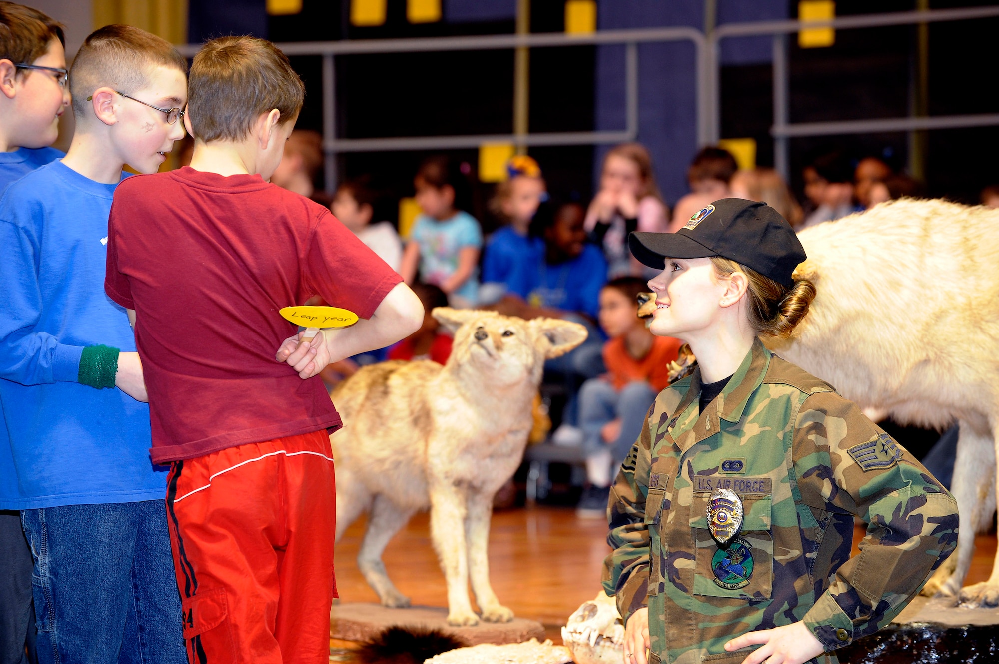 Staff Sgt. Sabriena Childers discusses wildlife safety with grade school students at Aurora Elementary during a school assembly. Sergeant Childers is a military conservation agent and took the opportunity to remind the children to avoid putting themselves into situations where they could get hurt by moose, bears and wolves that reside at Elmendorf Air Force Base, Alaska. (U.S. Air Force photo/Master Sgt. Keith Brown)