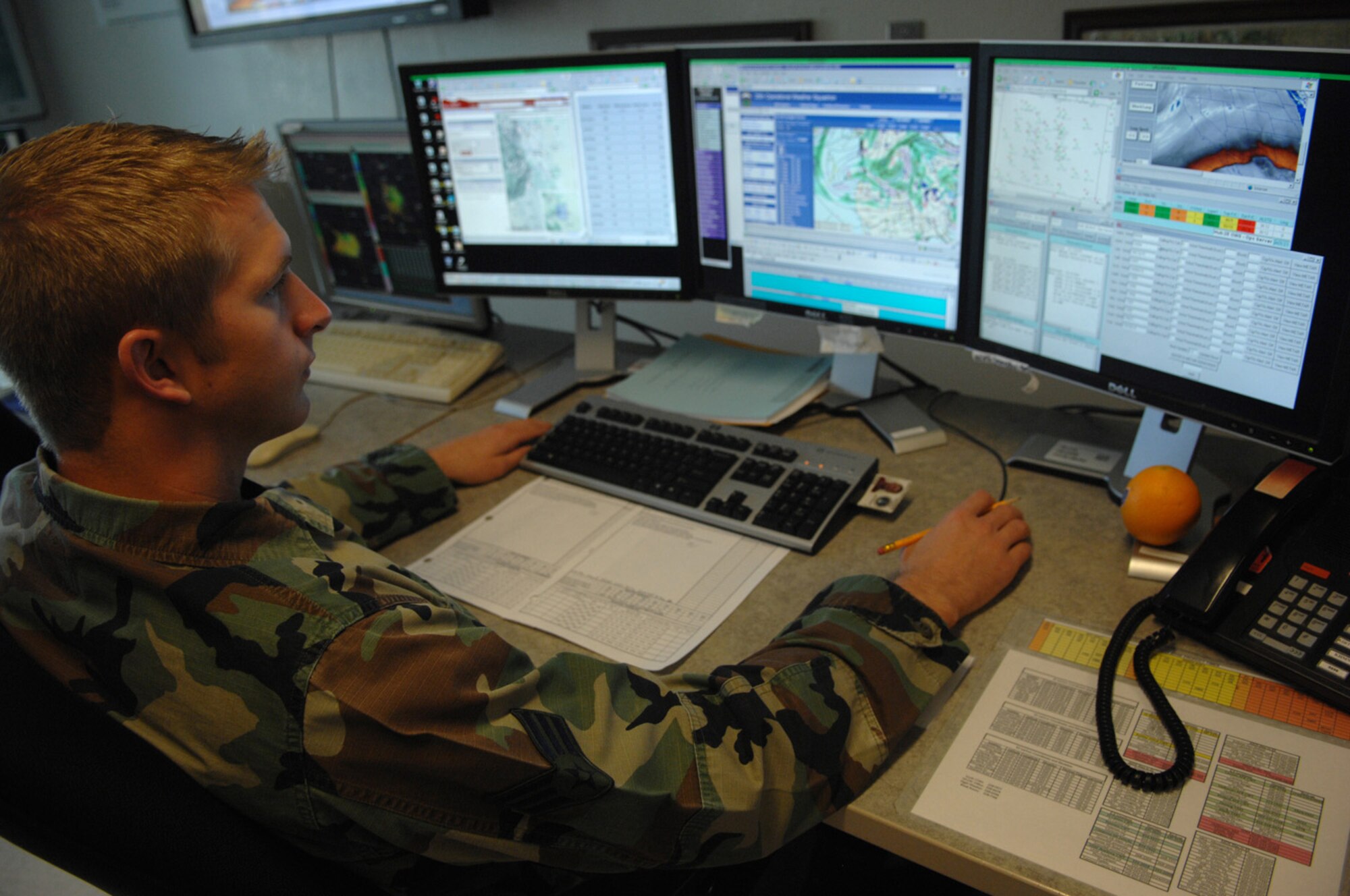 Senior Airman Travis Sanford, a weather forecaster for the 25th Operational Weather Squadron, monitors weather conditions across eight Colorado locations here April 22.  Airman Sanford is a member of the WXAE, East Region flight and is responsible for providing forecasts and resource protection for five states located throughout the western United States.  (U.S. Air Force photo by Senior Airman Alesia Goosic)