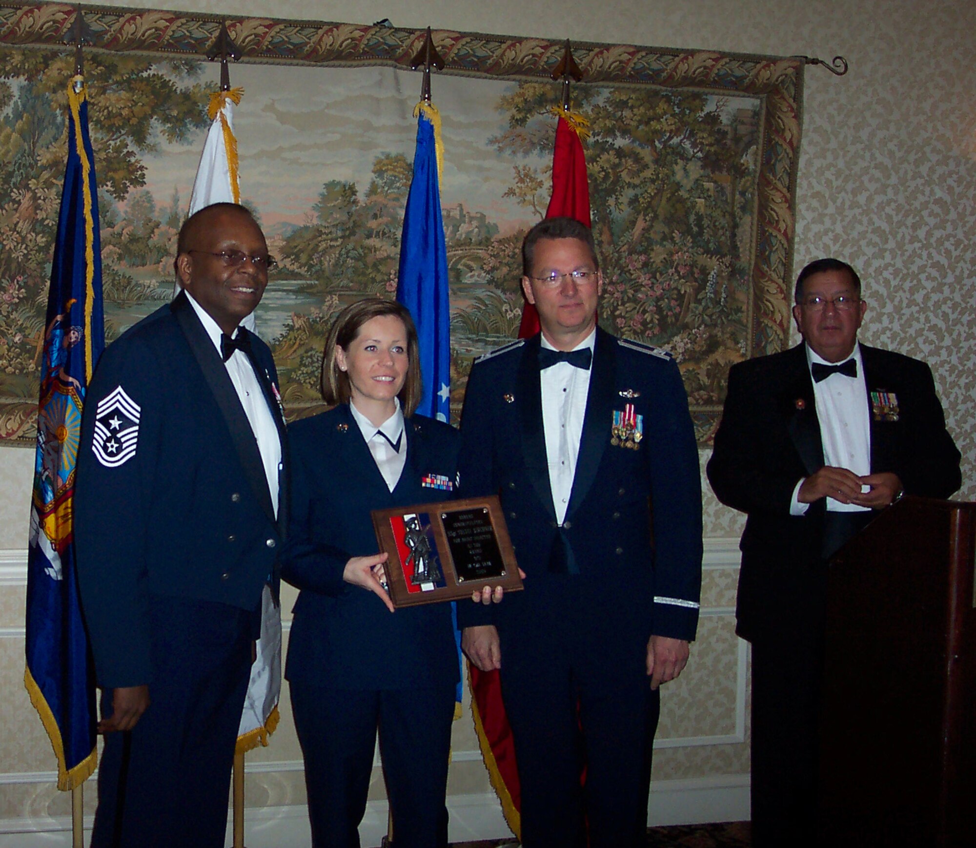 Staff Sgt. Sylvia Kirchner is awarded New York Air National Guard NCO of the Year 2007 at The Enlisted Association of the National Guard (EANGUS) New York State association conference April 12.  Also in the photo from left to right, Chief Master Sgt. Hardy Pierce, Col. John P. Bartholf, NEADS Commander,  and  EANGUS NYS (EANYNG) President Claude Imagna. 