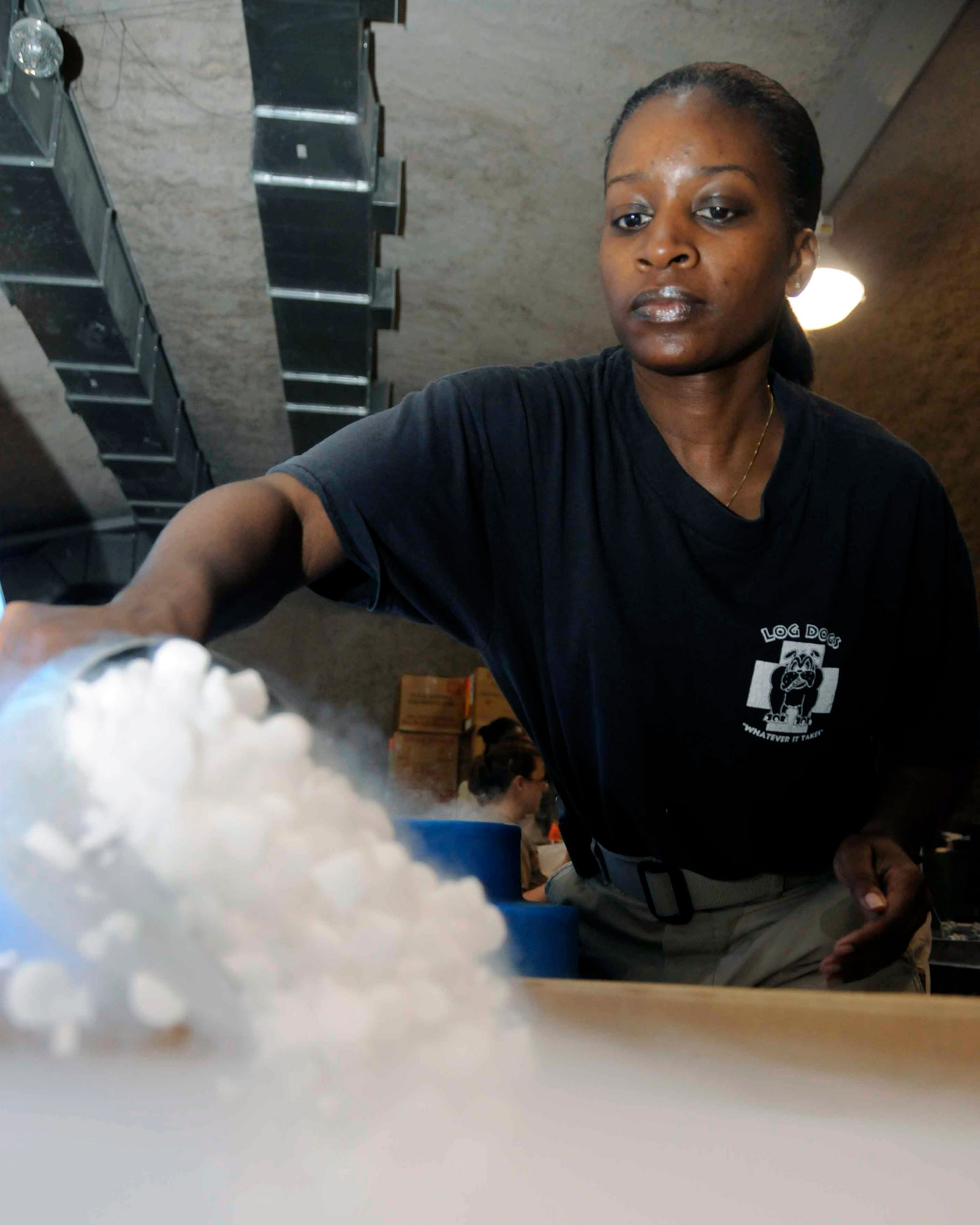 Tech. Sgt. Paula Todd scoops dry ice into a box used for shipping blood May 6 at the Blood Transshipment Center in Southwest Asia. Sergeant Todd is the NCO in charge of the BTC and is responsible for inventory and shipment of blood products throughout the Persian Gulf region. (U.S. Air Force photo) 