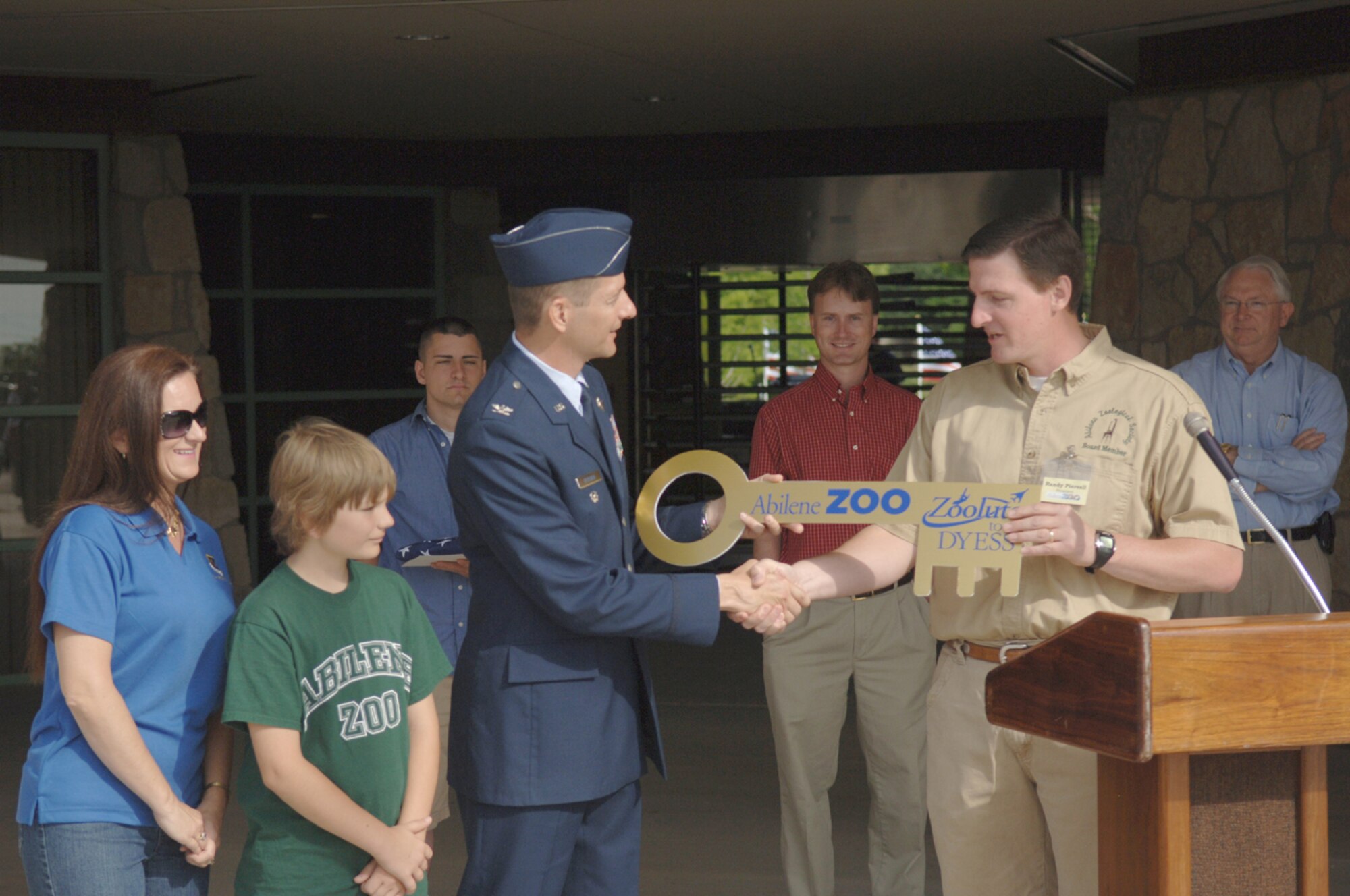 ABILENE, Texas -- Randy Piersall, Abilene Zoo president, presents Col. Gavin Ketchin, 7th Bomb Wing vice commander, with the key to the Abilene Zoo May 17. The zoo invited all of Dyess' servicemembers and their families to the annual Zoolute to Dyess. (U.S. Air Force photo by Airman 1st Class Michael Breaux)