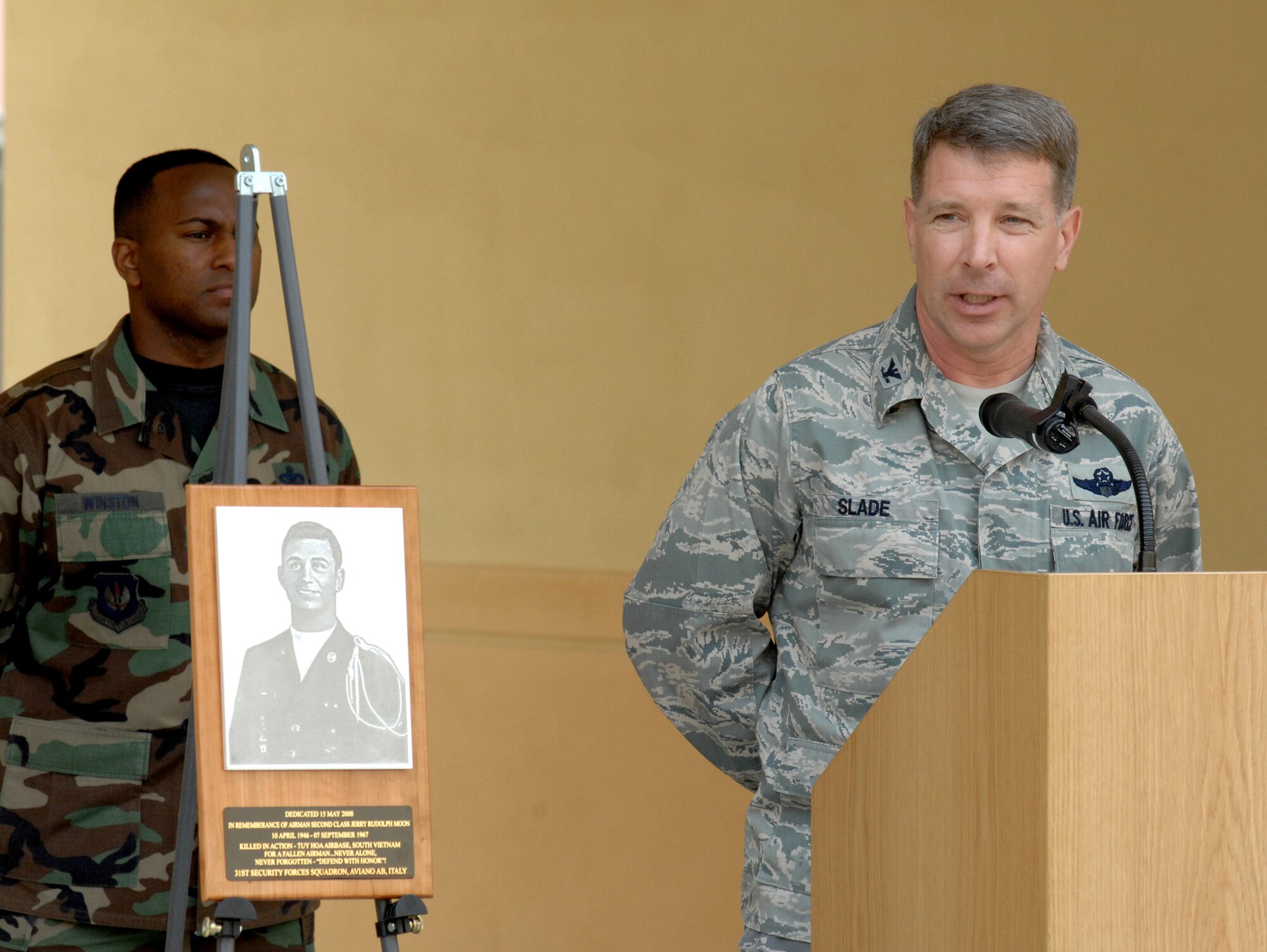 AVIANO AIR BASE, Italy - Col. David Slade, 31st MSG commander, addresses U.S. and Italian Air Force personnel at the new security forces squadron building dedication May 15.  The new building consolidates 10 buildings that were spread out across two areas into one facility. Nearly all security forces customer service functions are located in the building, to include the police services desk, reports and analysis, security clearances and combat arms training and maintenance. (U.S. Air Force photo/Airman 1st Class Tabitha M. Mans)  