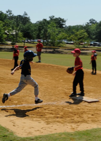 VALDOSTA, Ga. -- Davis Hewett, son of Master Sgt. Mark Hewitt, 71st Rescue Squadron flight engineer, runs to first base after hitting a ball during a baseball game at Valdosta, Ga., May 17. The 71st Rescue Squadron sponsors The Kings, a baseball team of six and seven-year-olds, to give back to the community. (U.S. Air Force photo by Airman 1st Class Brittany Barker)