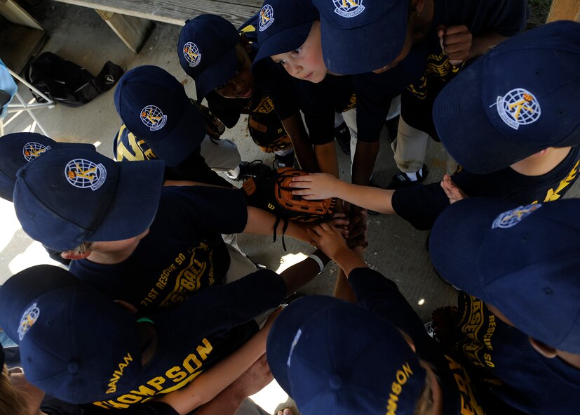 VALDOSTA, Ga. -- Six and seven-year-olds of The Kings baseball team huddle before a game at Valdosta, Ga., May 17. Moody Air Force Base's 71st Rescue Squadron sponsors The Kings. (U.S. Air Force photo by Airman 1st Class Brittany Barker) 