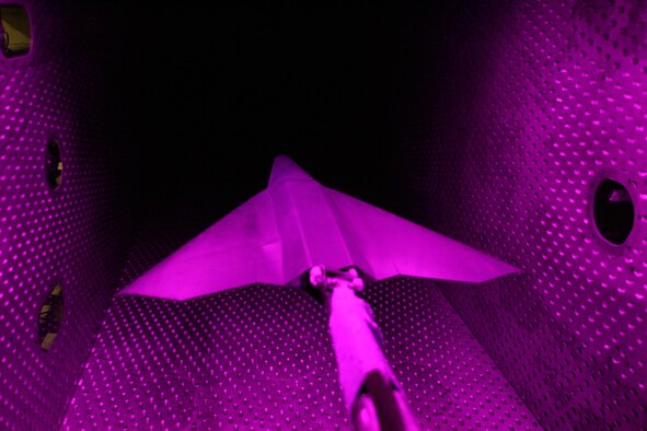 A one-eighteenth scale model of an Air Force tailless aircraft underwent aerodynamic testing in Arnold Engineering Development Center's four-foot transonic wind tunnel. The test was a technology demonstration entry in which conventional methods and Pressure Sensitive Paint were used to compare the effectiveness of a jet effects spoiler with a solid spoiler in yaw and roll control and stability of the aircraft. (Photo by Rick Goodfriend)