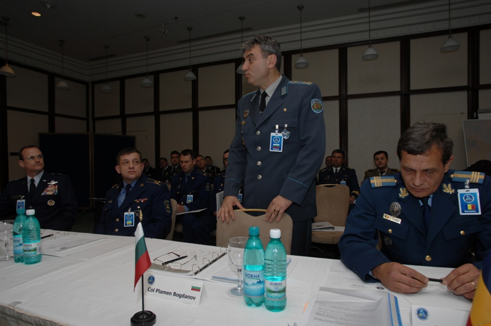 BUCHAREST, ROMANIA-Bulgarian Col. Plamen Nikolov Bogdanov briefs U.S. Air Force Brig. Gen. Richard Johnston (far left), and other participants in the Romania Building Partnership Seminar, part of Unified Engagement, a transformation wargame designed to explore future joint warfighting concepts and capabilities. The event in Romania consisted of approximately 60 military leaders and support staff members from eight nations focused on objectives that maximize cooperation and coalition building. 
