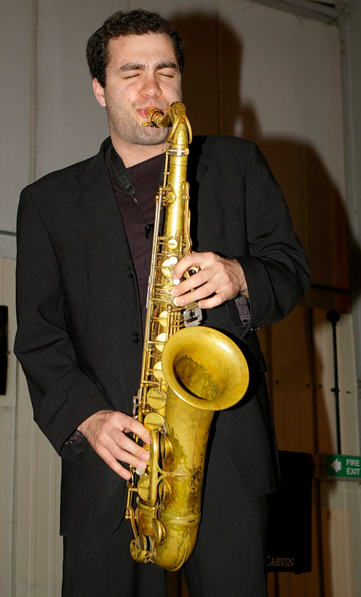 Josh Ison, a member of the Rick Hudson Quartet, plays the saxophone at RAF Mildenhall's Mayfair Bazaar May 15. The group played jazz music throughout the evening and during the weekend while shoppers visited the annual event. (U.S. Air Force photo by Karen Abeyasekere)