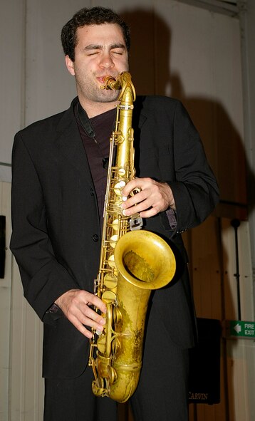 Josh Ison, a member of the Rick Hudson Quartet, plays the saxophone at RAF Mildenhall's Mayfair Bazaar May 15. The group played jazz music throughout the evening and during the weekend while shoppers visited the annual event. (U.S. Air Force photo by Karen Abeyasekere)