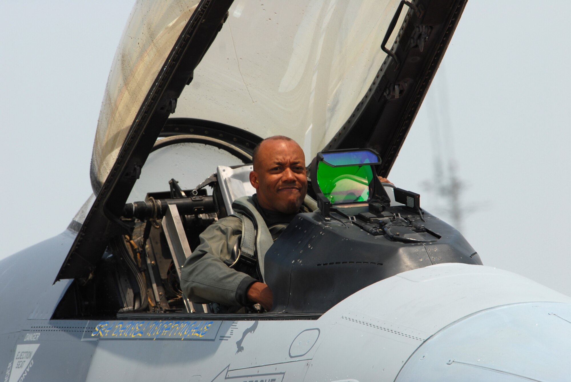 KUNSAN AIR BASE, Republic of Korea -- Colonel CQ "Wolf" Brown, 8th Fighter Wing commander, exits an F-16 after completing his fini-flight here May 19. The fini-flight is a time-honored military aviation tradition marking the end of a pilot's or commander's time, upon completion of their final flight. (U.S.Air Force Photo/Senior Airman Angela Ruiz)