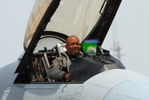 KUNSAN AIR BASE, Republic of Korea -- Colonel CQ "Wolf" Brown, 8th Fighter Wing commander, exits an F-16 after completing his fini-flight here May 19. The fini-flight is a time-honored military aviation tradition marking the end of a pilot's or commander's time, upon completion of their final flight. (U.S.Air Force Photo/Senior Airman Angela Ruiz)