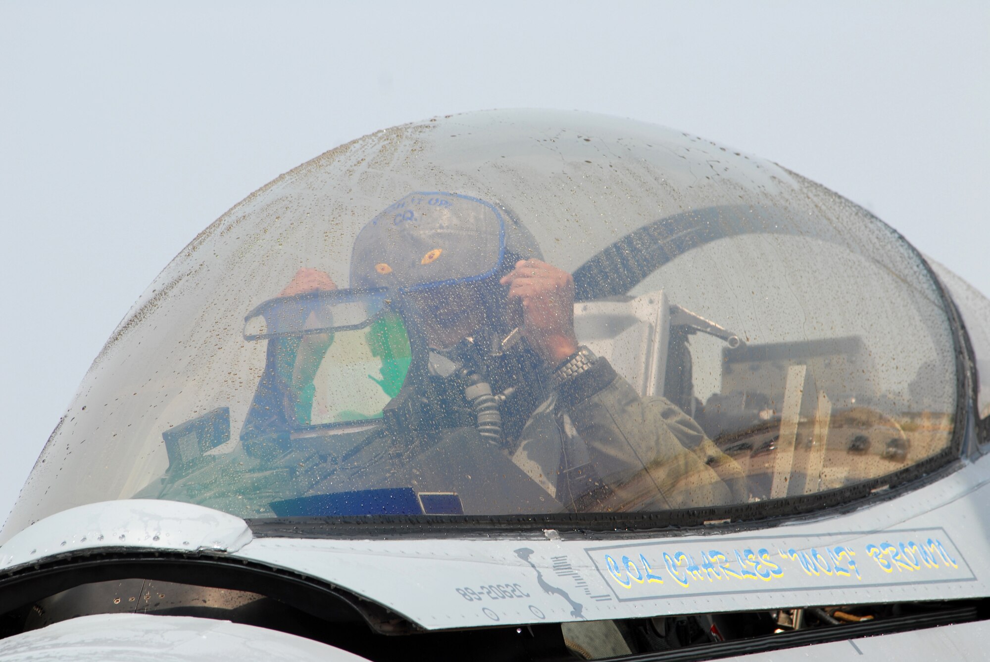 KUNSAN AIR BASE, Republic of Korea -- Colonel CQ "Wolf" Brown, 8th Fighter Wing commander, prepares to exit an F-16 after completing his fini-flight here May 19. The fini-flight is a time-honored military aviation tradition marking the end of a pilot's or commander's time, upon completion of their final flight. (USAF Photo By: Senior Airman Angela Ruiz)
