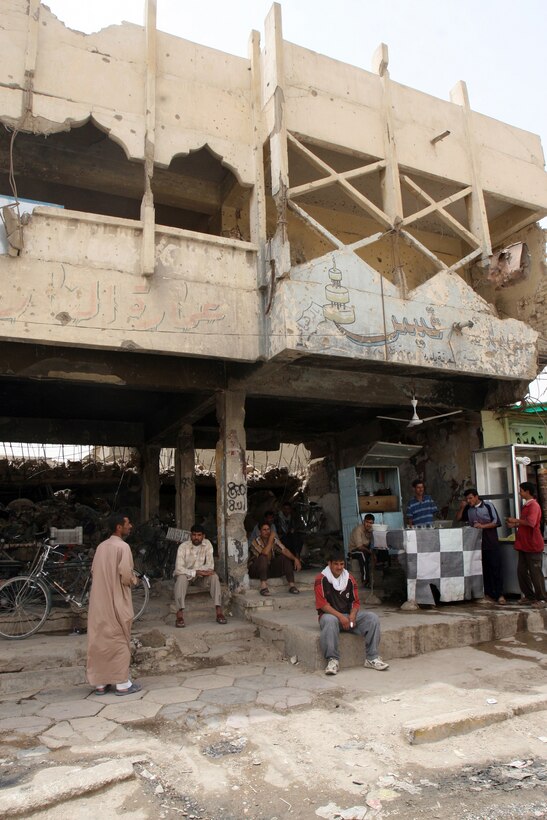 At a main intersection in the Jolan district of Fallujah, buildings like this one are being considered for teardown. Company K, 3rd Battalion, 6th Marine Regiment, Regimental Combat Team-1 is working with city officials to develop project proposals for area improvements. (Official U.S. Marine Corps photo by Cpl. Chris Lyttle) (RELEASED)