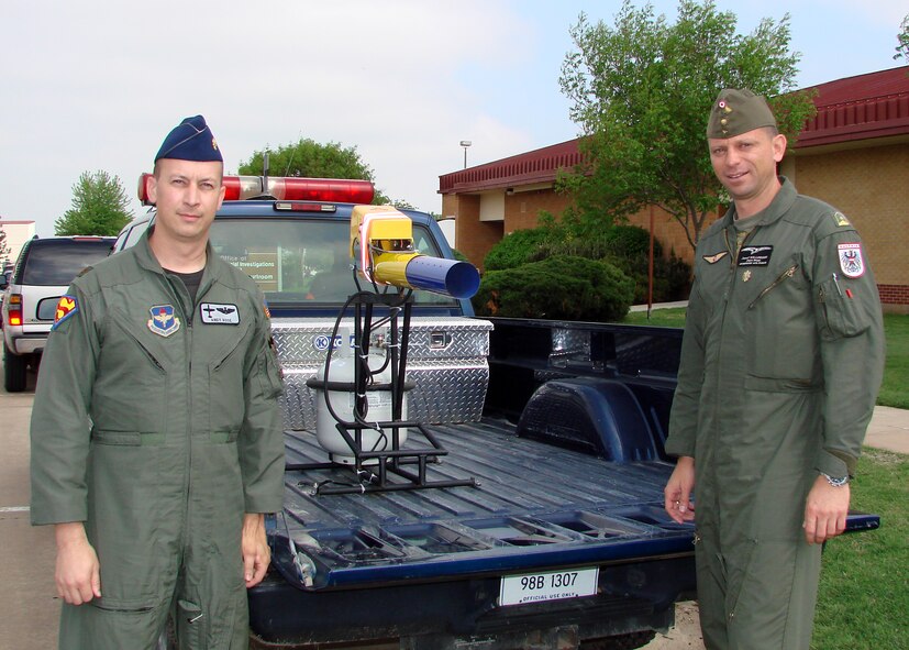 Maj. Josef "Supa Sep" Willegger, Austrian Air Force C-130 pilot (right) visits U.S. Air Force Maj. Andy "Axl" Rose, chief of the 71st Flying Training Wing Safety office here. Maj. Josef Willegger recently completed a three month International Flight Safety Officer's Course at Kirtland Air Force Base.
