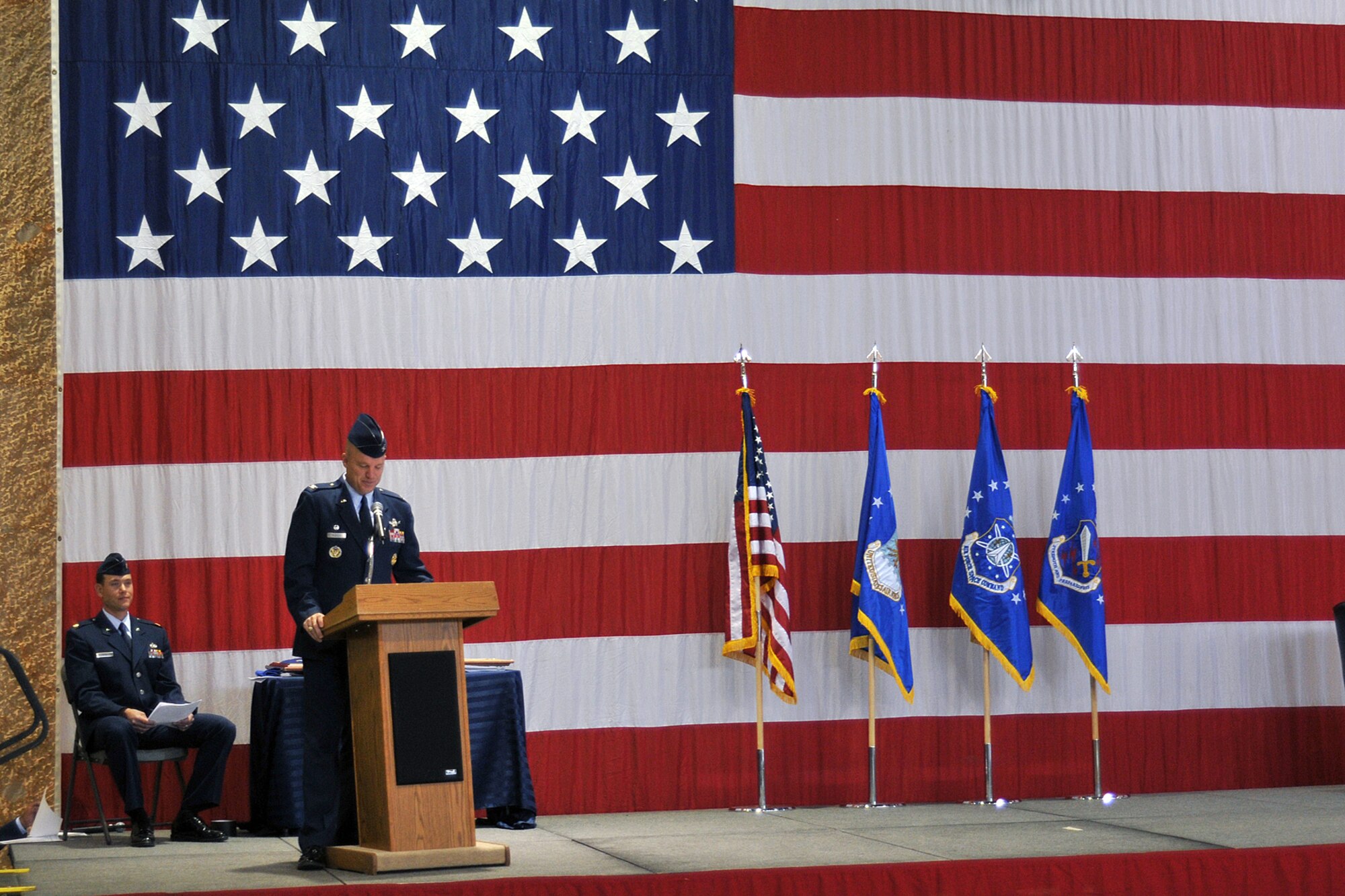Col. Jay Raymond, 21st Space Wing commander, speaks to the last members of the 21st Maintenance Group May 15 at Peterson Air Force Base, Colo. The 21st MXG officially deactivated as part of an effort to better organize the 21st SW’s units. (U.S. Air Force photo/Larry Hulst)