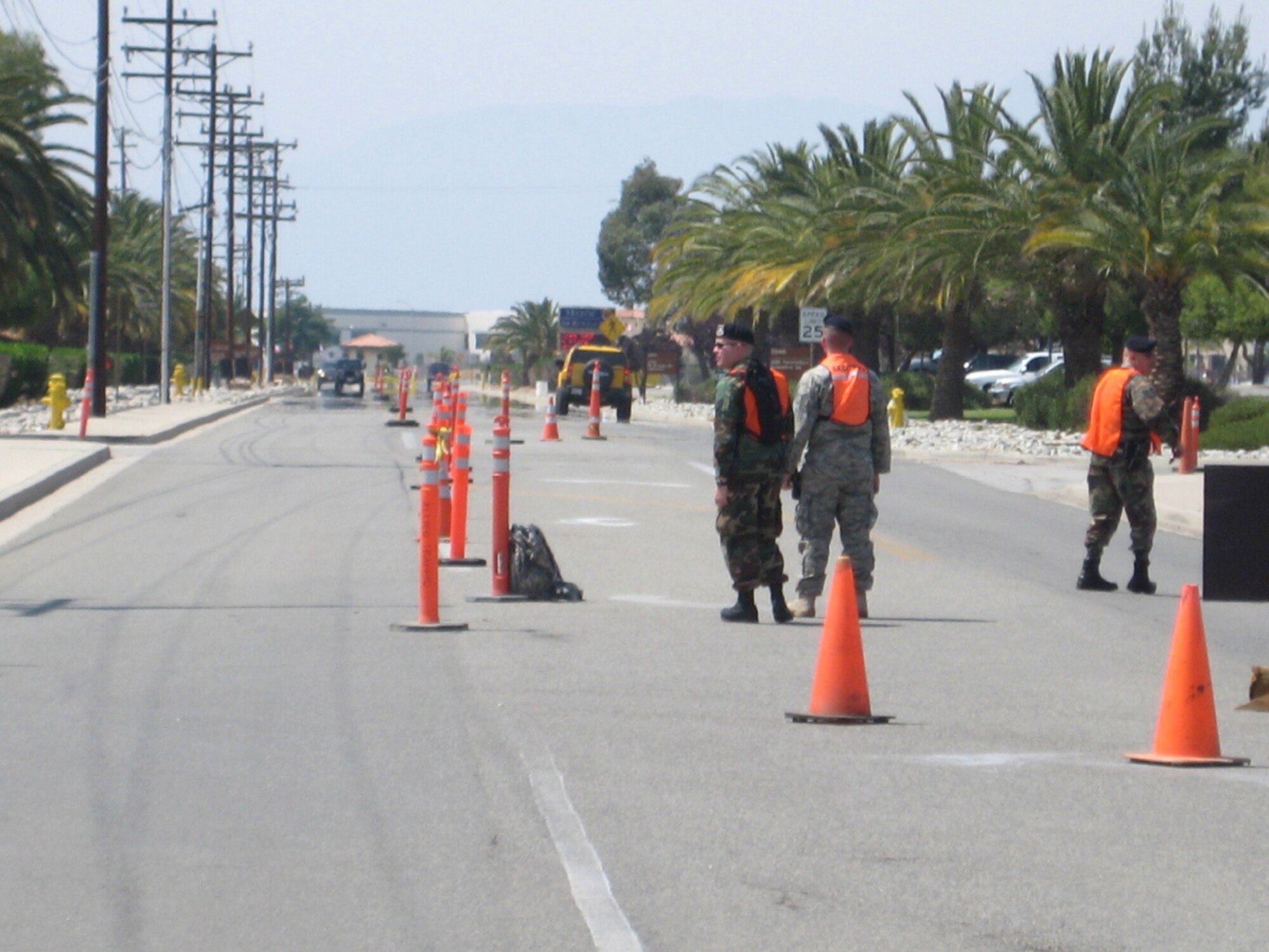 WRIGHT-PATTERSON AFB, Ohio - Reservists from the 445th Security Forces Squadron, place cones on the street to direct traffic during the Thunder Over the Empire Air Show at March Air Reserve Base, Calif.  The Airmen augmented March ARB Security Forces for the two day event that hosted about 400,000 people. (Courtesy photo) 