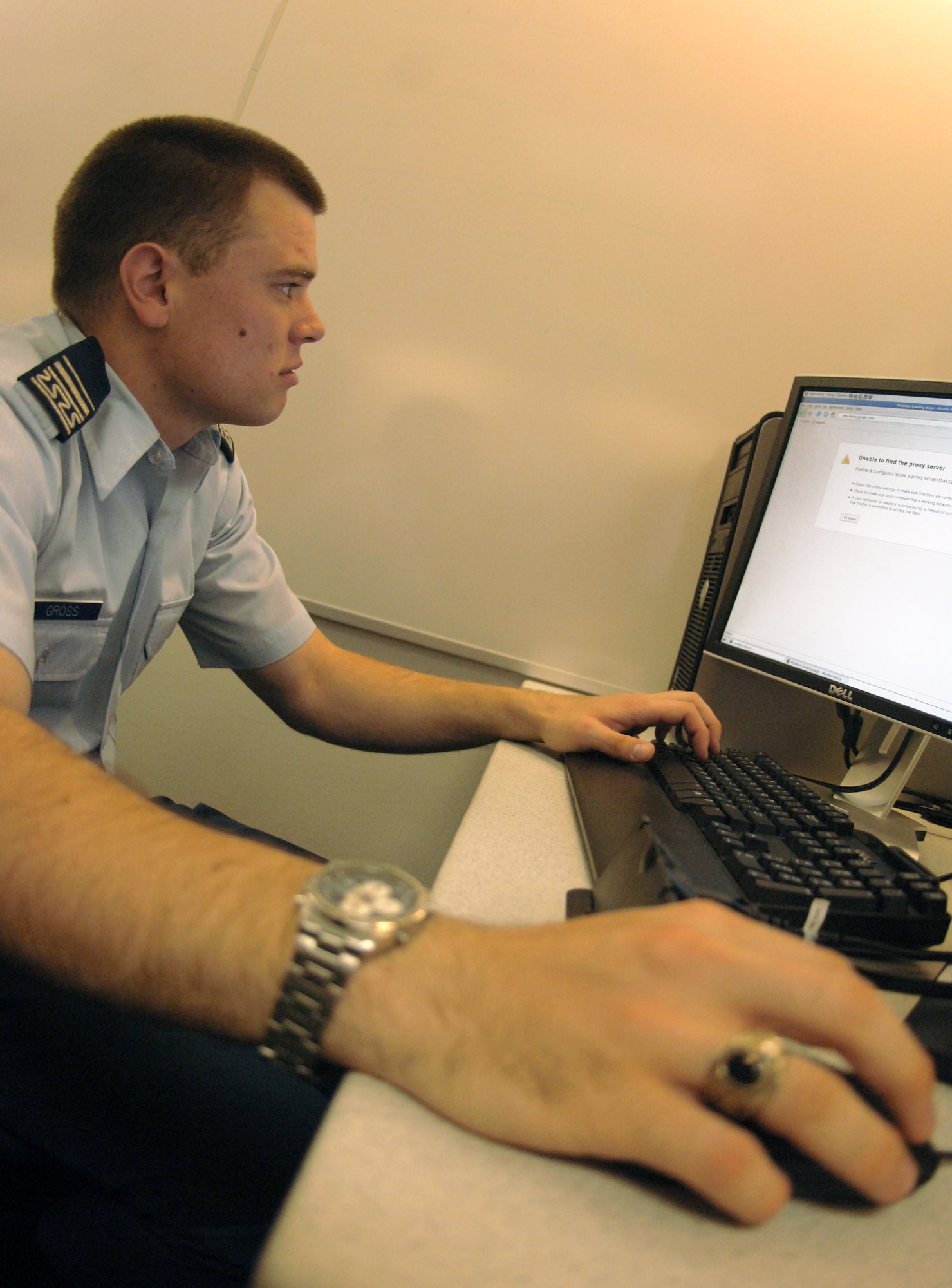 Cadet 1st Class Aaron Gross checks out the network during lab time May 12 at the Air Force Academy in Colorado. The cadet, from Anaheim, Calif., will be one of the first Academy graduates to go directly from the school to the Air Force Institute of Technology's cyber warfare track. Cadet Gross, a member of the Academy's Cadet Squadron 3, researched active-eye detection in video streams for his information warfare class. (U.S. Air Force photo/Staff Sgt. Tim Jenkins) 