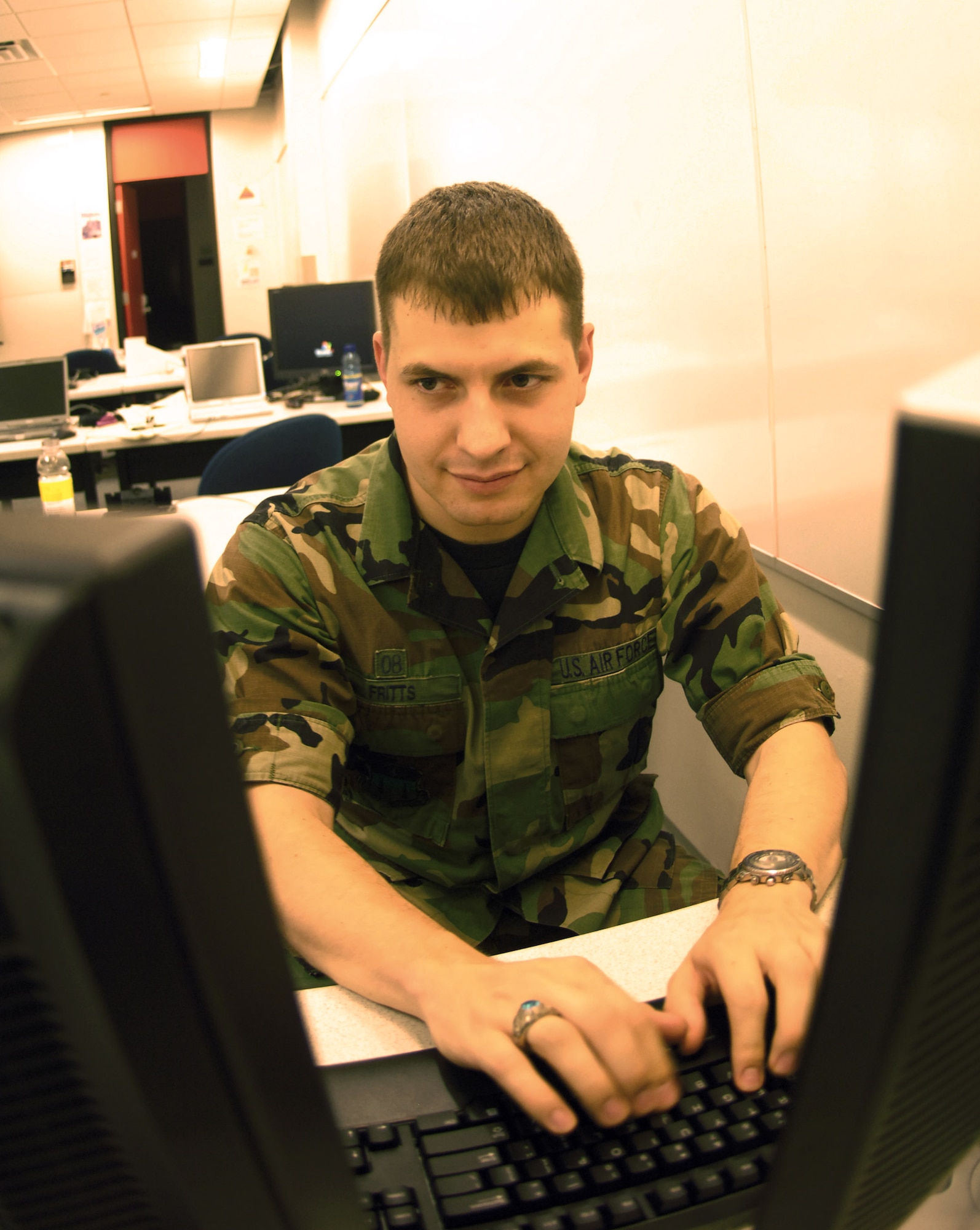 Cadet 1st Class Nick Fritts goes through computer code May 12 in one of the Air Force Academy's computer labs. The cadet, a member of Cadet Squadron 12 and a Dallas native, will be one of the first Academy graduates to go directly from the school to the Air Force Institute of Technology's cyber warfare track. Cadet Fritts spent three years managing corporate computer networks before joining the military. (U.S. Air Force photo/Staff Sgt. Tim Jenkins) 