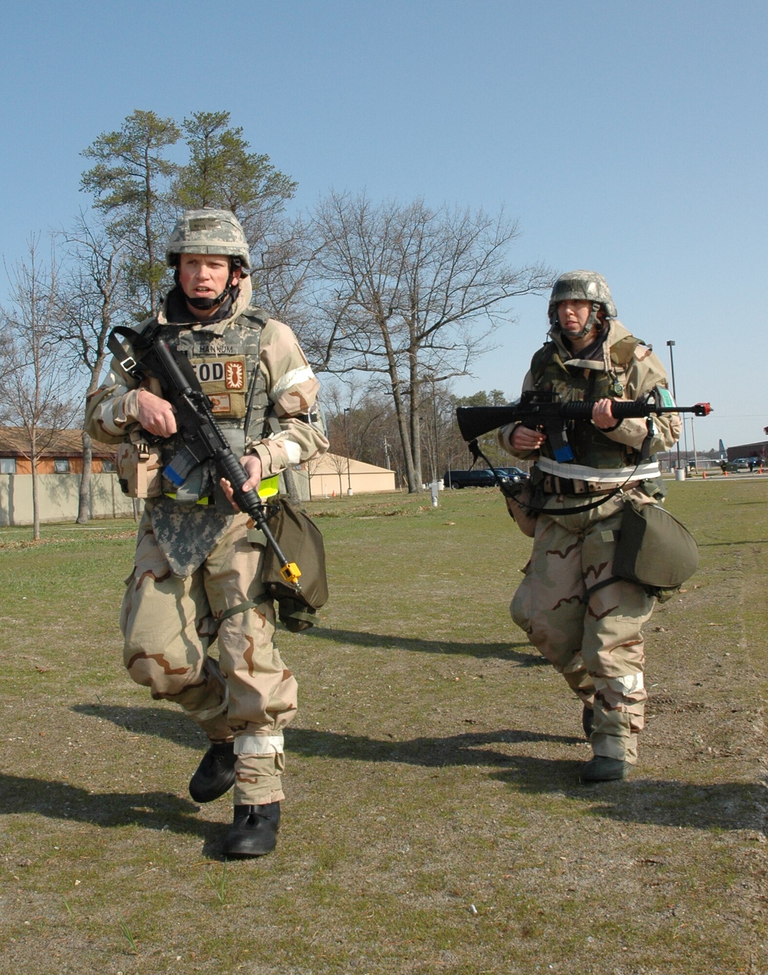 Capt. Kelly Hannum, 436th Civil Enginer Squadron, and Master Sgt. Melissa Phillips, 436th Airlift Wing, secure an evacuation route during the operational readiness exercise at Alpena, Mich., April 20 to 25.  (U.S. Air Force Photo/Master Sgt. Steve Marciniak)