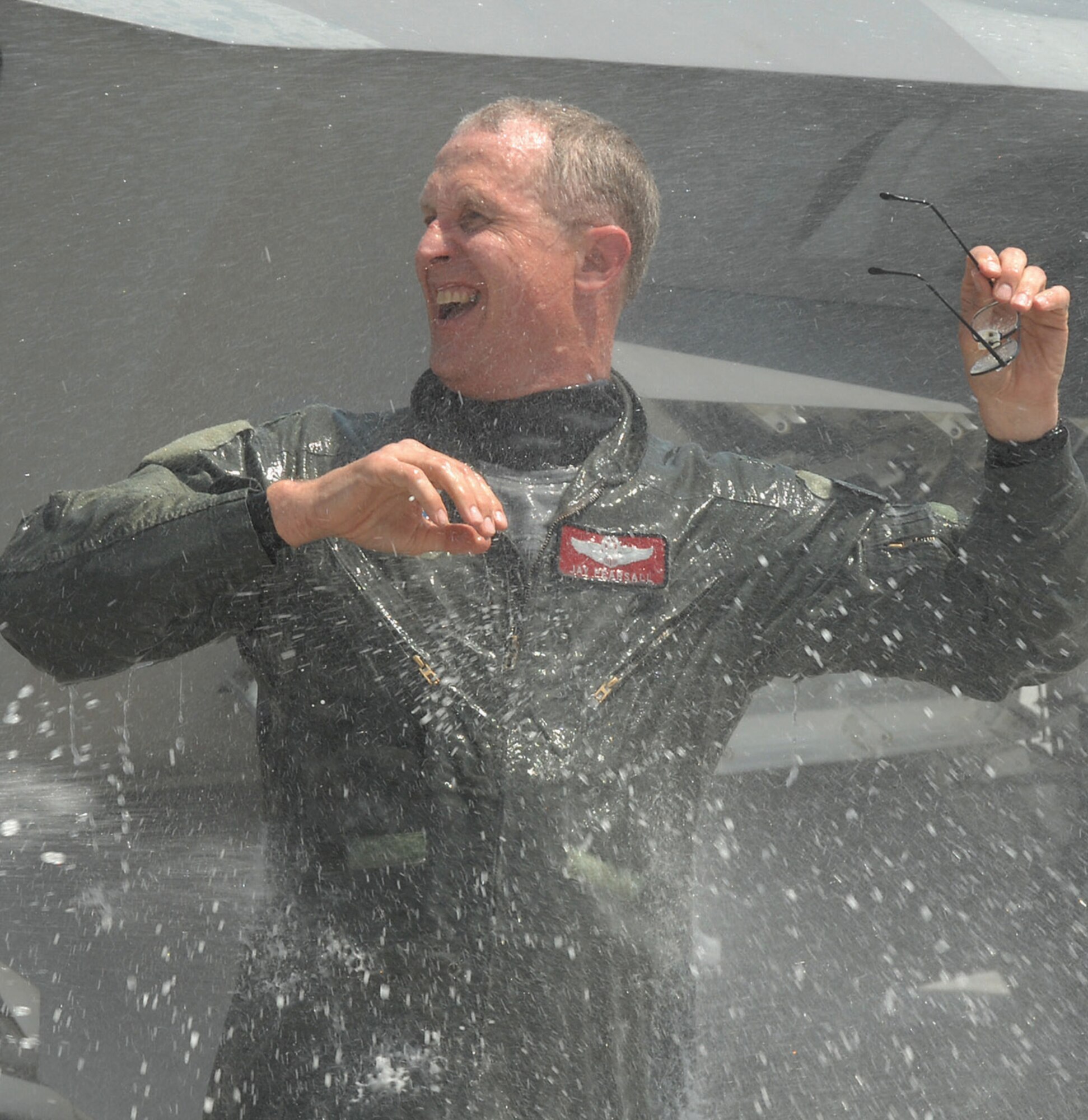 LANGLEY AIR FORCE BASE, Va. -- Col. Jay Pearsall, previous 192nd Fighter Wing commander, gets drenched after his final flight in the F-22A Raptor May 15.  Military members, friends and family gathered on the flightline near the 94th Fighter Squadron to honor him for more than 25 years of service.  (U.S. Air Force photo/Master Sgt Carlos J. Claudio)