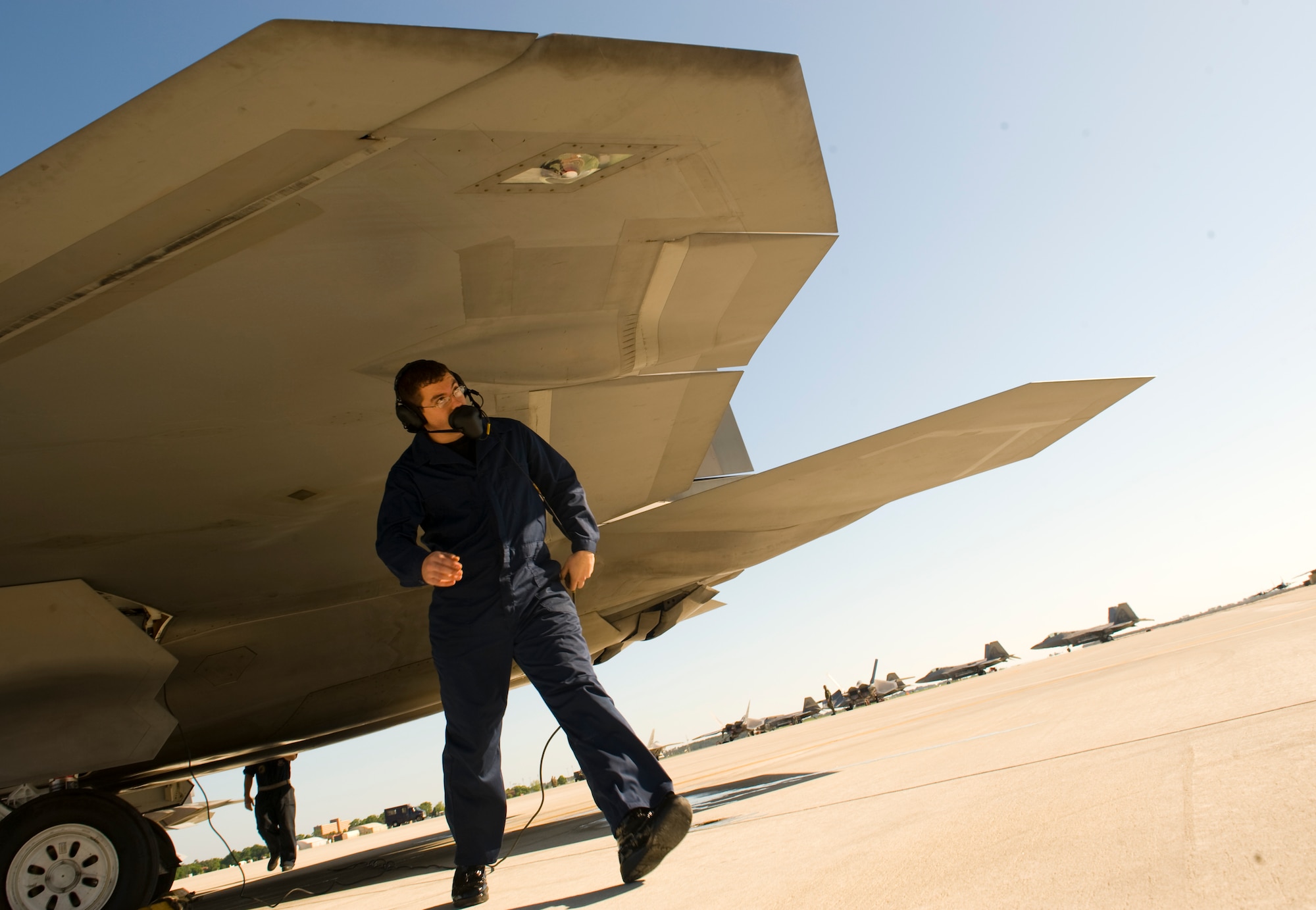 LANGLEY AIR FORCE BASE, Va. -- Staff Sgt. Richard Alexander, an F-22A Raptor dedicated crew chief with the 192nd Fighter Wing, goes through flight checks before the morning mission May 17. The 192nd FW is the first Guard unit to fly the Raptors. The 192nd has more than 20 pilots trained to fly the F-22A and an increasing number of full-time and traditional guardsmen working alongside active-duty personnel. May 17 and 18 marked the first time the 192nd generated aircraft sorties with a majority of Guard personnel since their integration with the 1st Fighter Wing. (U.S. Air Force photo/Staff Sgt. Samuel Rogers)