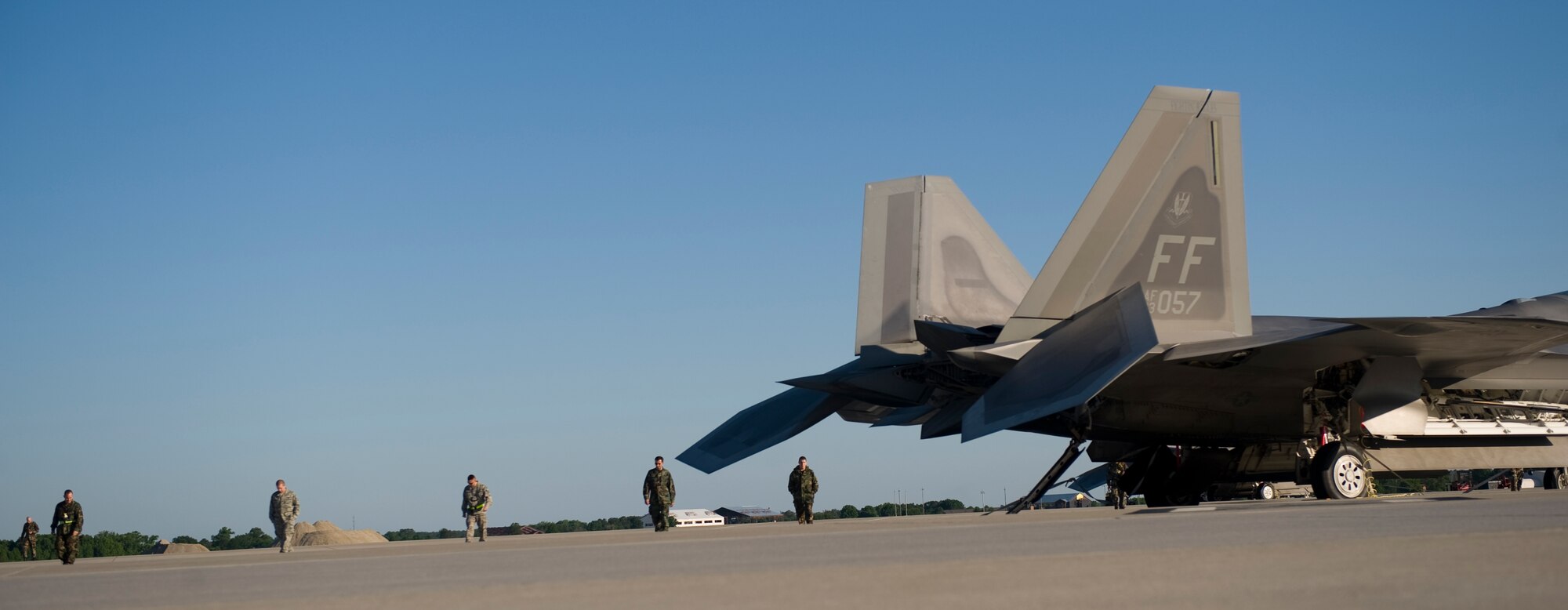 LANGLEY AIR FORCE BASE, Va. -- F-22A Raptor maintenance personnel with the Virginia Air National Guard’s 192nd Fighter Wing check the flightline for foreign object debris before the morning mission May 17. The 192nd FW is the first Guard unit to fly the Raptors. The 192nd has more than 20 pilots trained to fly the Air Force's newest air superiority jet and an increasing number of full-time and traditional guardsmen working alongside active-duty personnel. May 17 and 18 marked the first time the 192nd generated aircraft sorties with a majority of Guard personnel since their integration with the 1st Fighter Wing. (U.S. Air Force photo/Staff Sgt. Samuel Rogers)