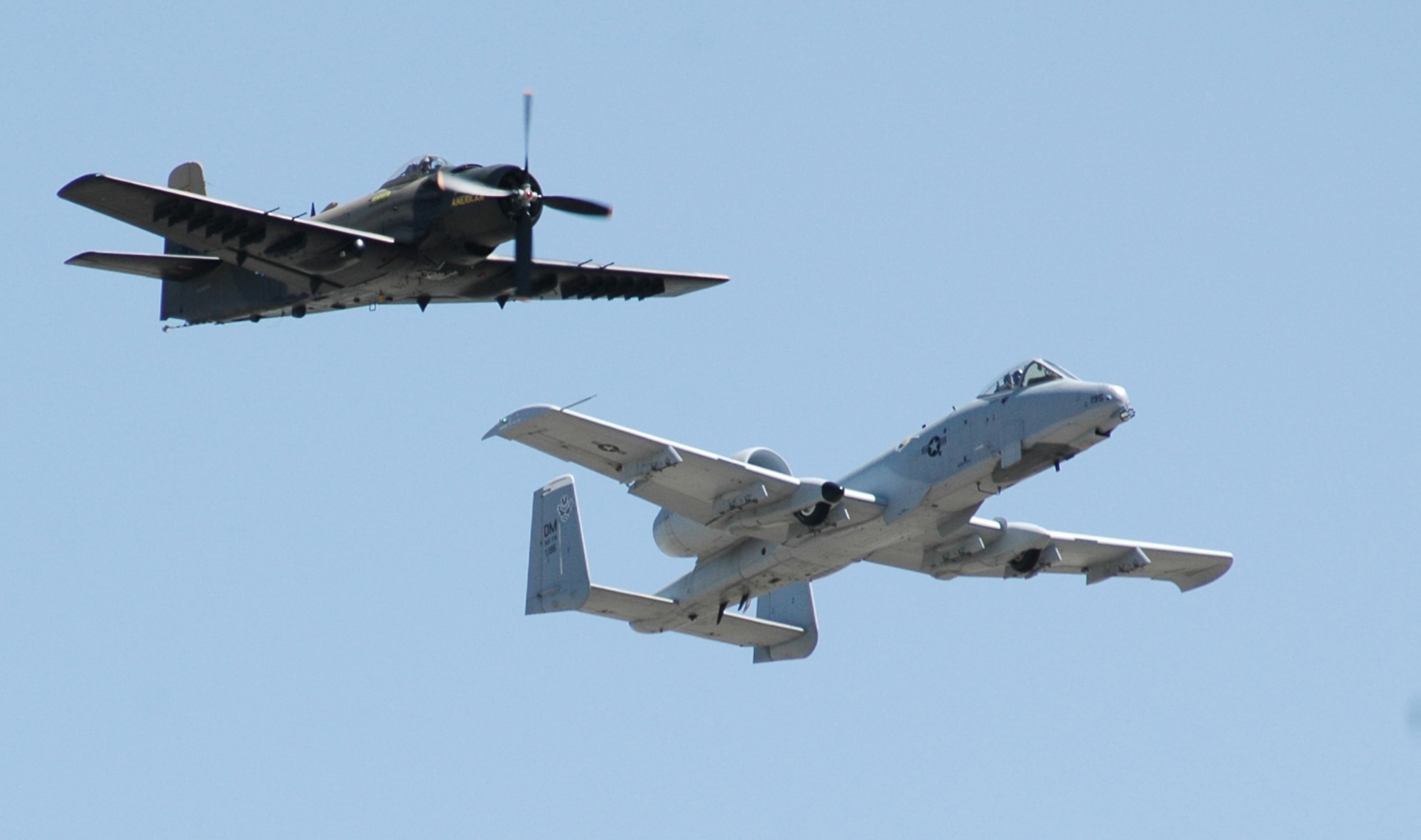 An A-1 “Skyrider” flies with an Air Combat Command A-10 “Thunderbolt II” May 16 during a practice for the Heritage Flight which was one of the featured events at this year's Air Show and Open House. (U.S. Air Force photo/Airman 1st Class Emerald Ralston)