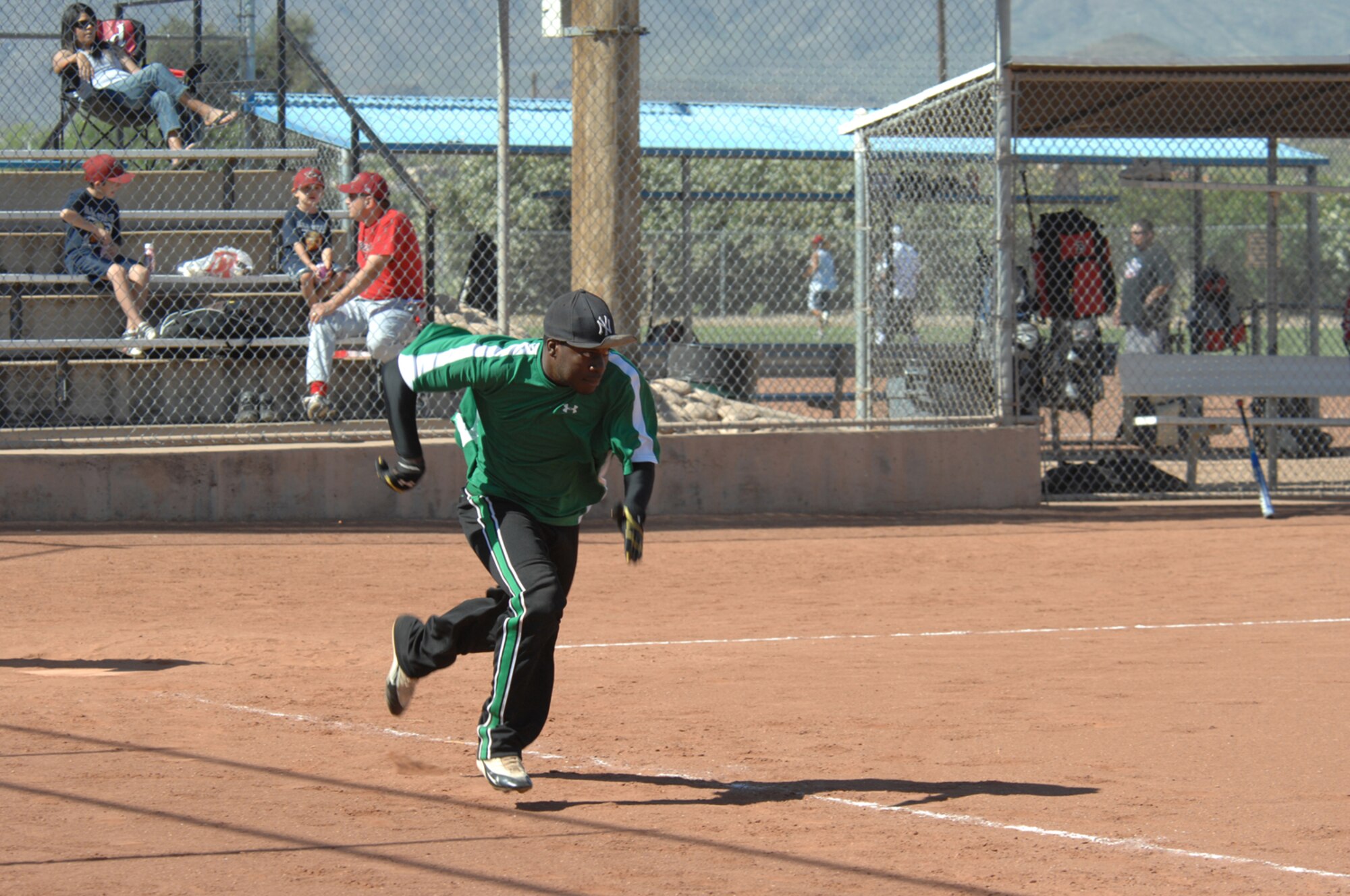 Airman 1st Class Shamond Hoskins, 355th Security Forces Squadron, runs to first base during the United States Specialty Sports Association Slow-Pitch Men's Softball Tournament at the Tucson Sportspark May 17. (U.S. Air Force photo by Airman 1st Class Noah R. Johnson)