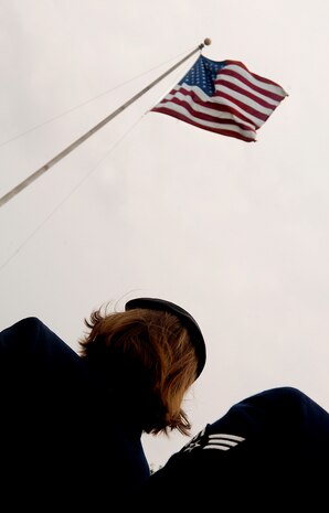 SFS Airmen stand at ease before the playing of the National Anthem during retreat at the base flag pole May 16. Retreat signified the end of Police Week and was an opportunity to honor those who have fallen in the line of duty. (U.S. Air Force photo/Senior Airman Nicholas Pilch)