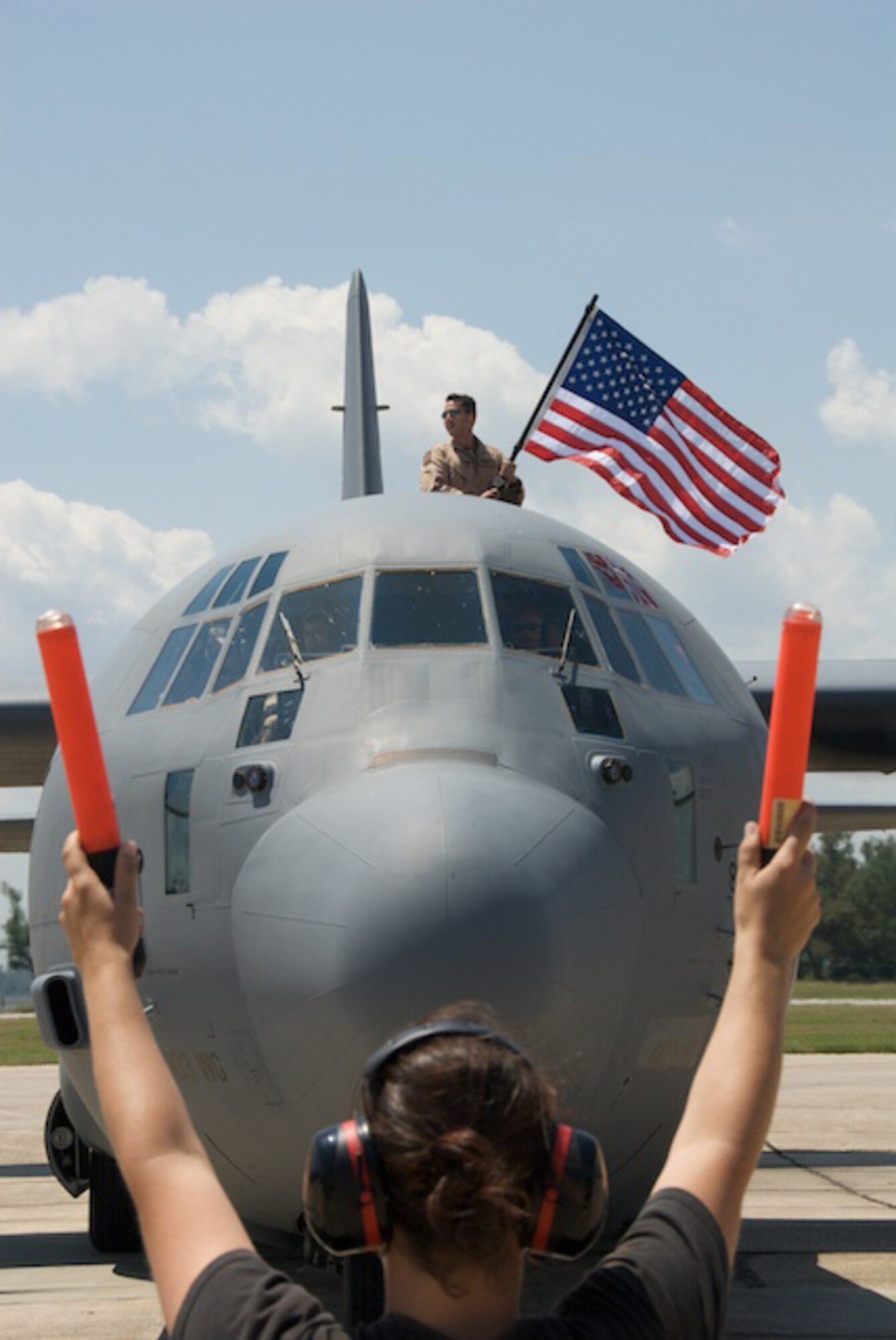 Captain Mark Suckow, pilot for the 815th Airlift Squadron "Flying Jennies" waves the flag upon his return from the desert.

The Flying Jennies and the "Spirit of Biloxi" aircraft returned home from the desert May 19.

While deployed, the Jennies provided combat-multiplying capabilities to resupply forces, improved combatant commanders' airlift requirements and employment operations within the combat zone or forward areas, and when requested, provided aeromedical evacuation and augmented strategic airlift forces. 

Aircrews from the Air Force Reserve's 815th Airlift Squadron joined maintainers from the 403rd Maintenance Group and personnel from several support functions including Communications, Intelligence and others for the unit's second combat mission in Southwest Asia.

U.S. Air Force Photo/Tech. Sgt. James B. Pritchett