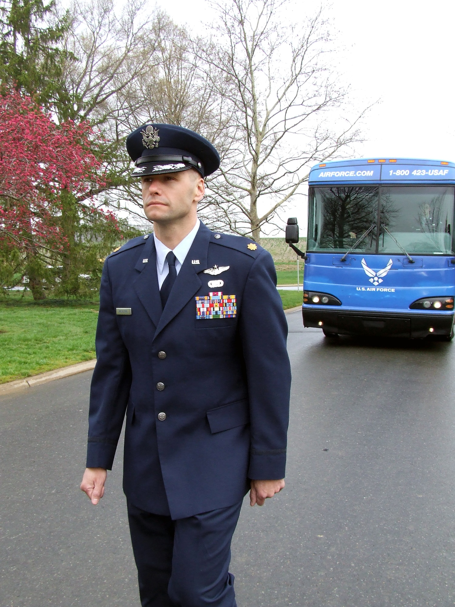 Maj. Phil Heseltine, U.S. Air Force Expeditionary Center executive officer to the commander walks with the funeral procession for former missing in action Airman Maj. Robert F. Woods during the funeral for Major Woods April 9, 2008, at Arlington National Cemetery, Va.  Prior to the funeral, Major Heseltine presented the family of Major Woods with a POW/MIA bracelet he wore for 18 years that was inscribed with Major Woods' name.  (U.S. Air Force Photo/Tech. Sgt. Scott T. Sturkol)