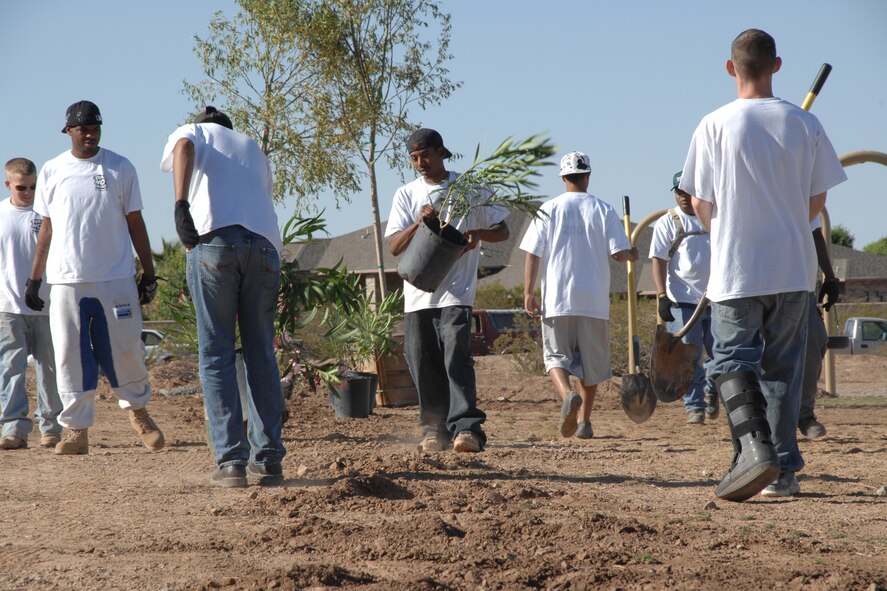 Members of the 49th Maintenance Group plant trees and shrubs May 6 at Tierra De Suenos Park in Alamogordo, N.M. The 15-person team of volunteers planted over 90 trees and 150 shrubs. (U.S. Air Force photo/Airman 1st Class Jamal D. Sutter)