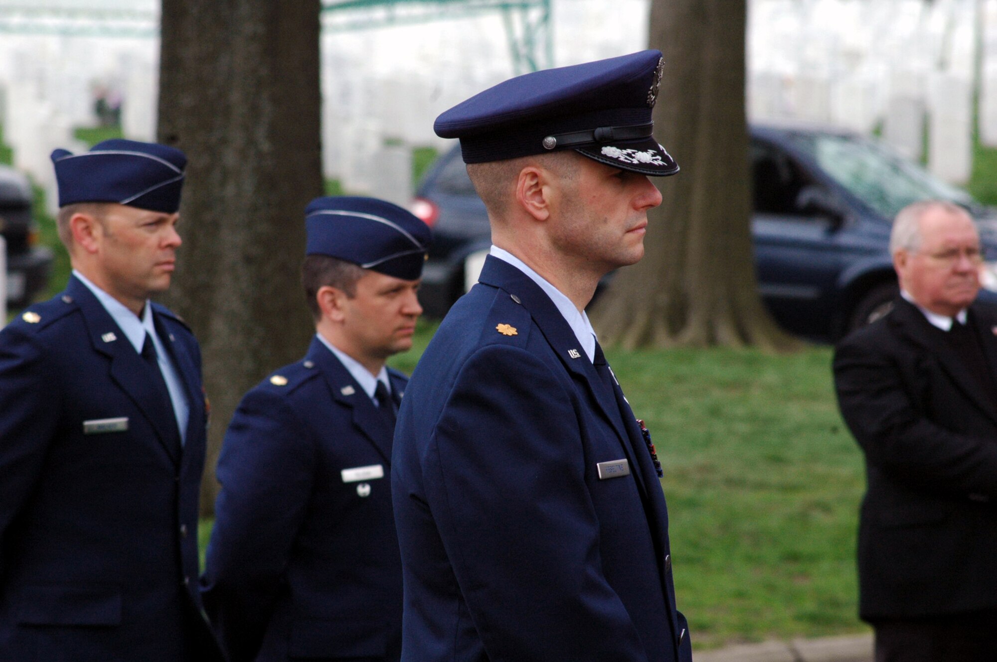 Maj. Phil Heseltine, U.S. Air Force Expeditionary Center executive officer to the commander, Fort Dix, N.J., participates in the funeral for Air Force Maj. Robert F. Woods April 9, 2008, at Arlington National Cemetery, Va.  Earlier that day, Major Heseltine presented POW/MIA bracelet to the family of Major Woods, whose name is on the bracelet that Major Heseltine wore for 18 years.  (U.S. Air Force Photo/Tech. Sgt. Scott T. Sturkol)