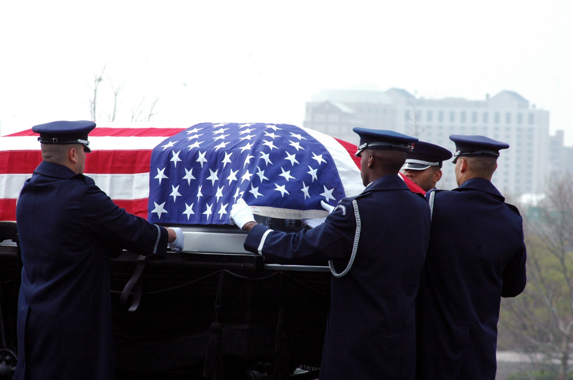 Airmen from the U.S. Air Force Honor Guard, Bolling Air Force Base, D.C., participate in the funeral for Air Force Maj. Robert F. Woods April 9, 2008, at Arlington National Cemetery, Va.  Major Woods, a former pilot who crashed in Vietnam on June 26, 1968, was laid to rest at the cemetery nearly 40 years after he disappeared.  (U.S. Air Force Photo/Tech. Sgt. Scott T. Sturkol)