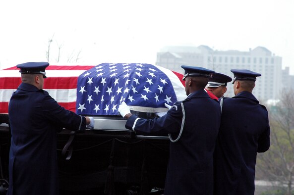 Airmen from the U.S. Air Force Honor Guard, Bolling Air Force Base, D.C., participate in the funeral for Air Force Maj. Robert F. Woods April 9, 2008, at Arlington National Cemetery, Va. Major Woods, a former pilot who crashed in Vietnam on June 26, 1968, was laid to rest at the cemetery nearly 40 years after he disappeared. (U.S. Air Force Photo/Master Sgt. Scott T. Sturkol) 